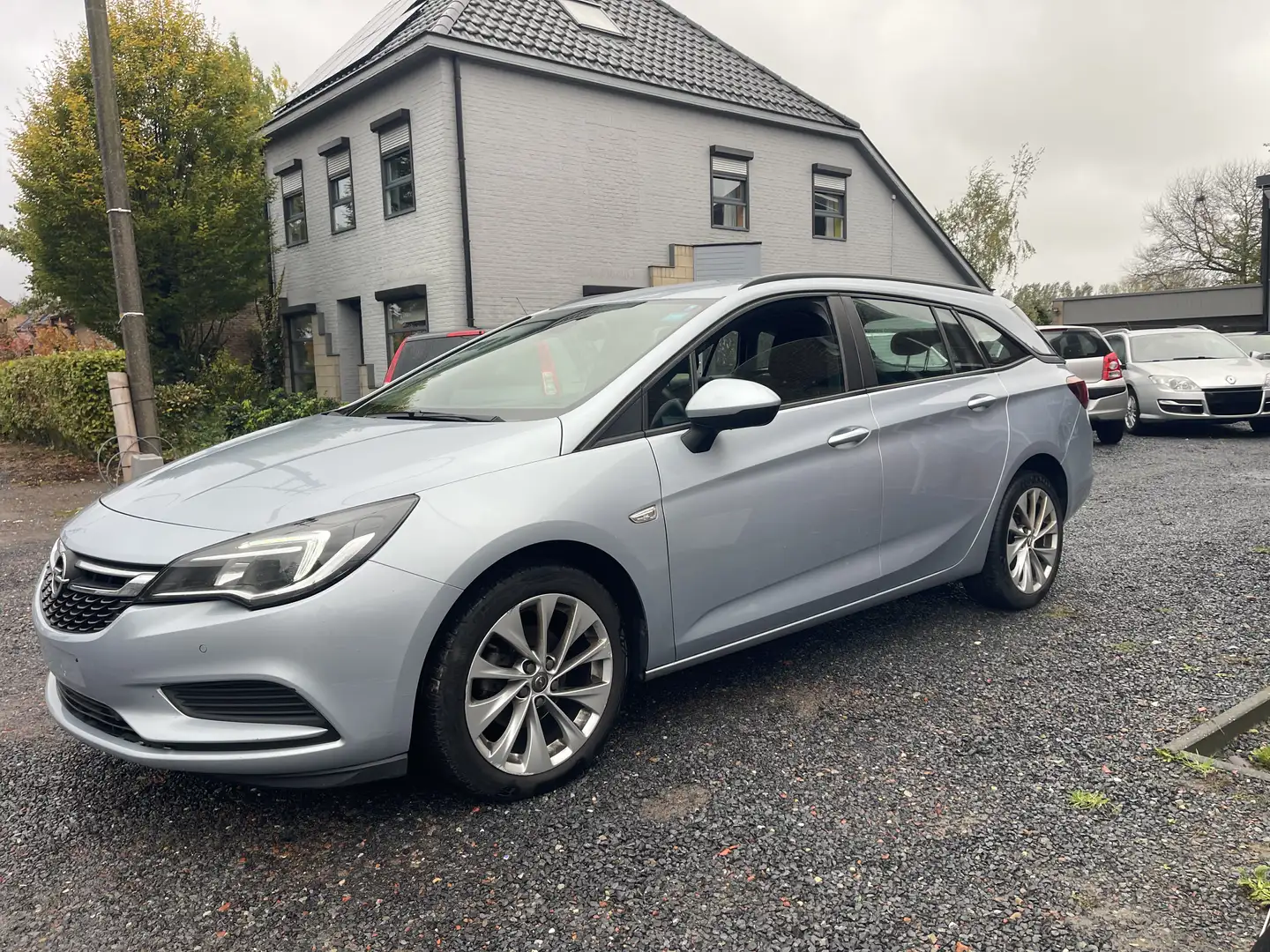Opel Astra 1.4 Turbo Sports Tourer,Airco,Gps,Sensoren,.. Grijs - 1