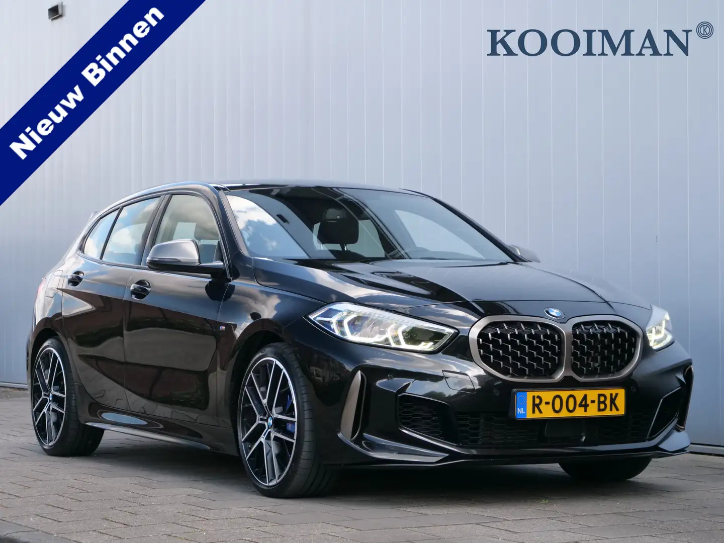 BMW 135 1-serie M135i 306pk xDrive High Executive Automaat Zwart - 1