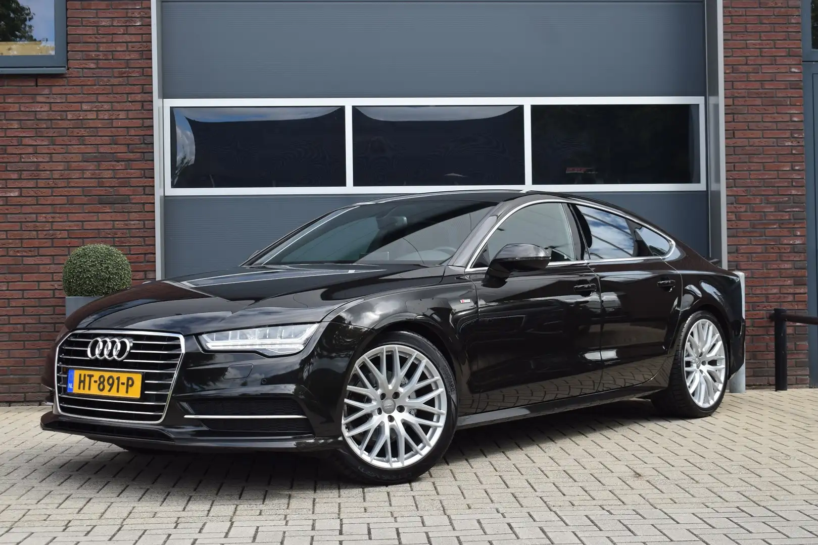 Audi A7 Sportback 1.8 TFSI 190pk S-line | Leer | Camera | Negro - 1