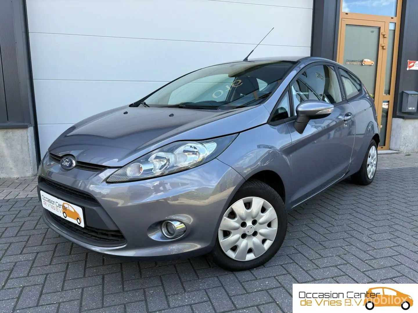 Ford Fiesta 1.25 Airco Elektr Pakket Stoelverwarmd Bluetooth Grijs - 1