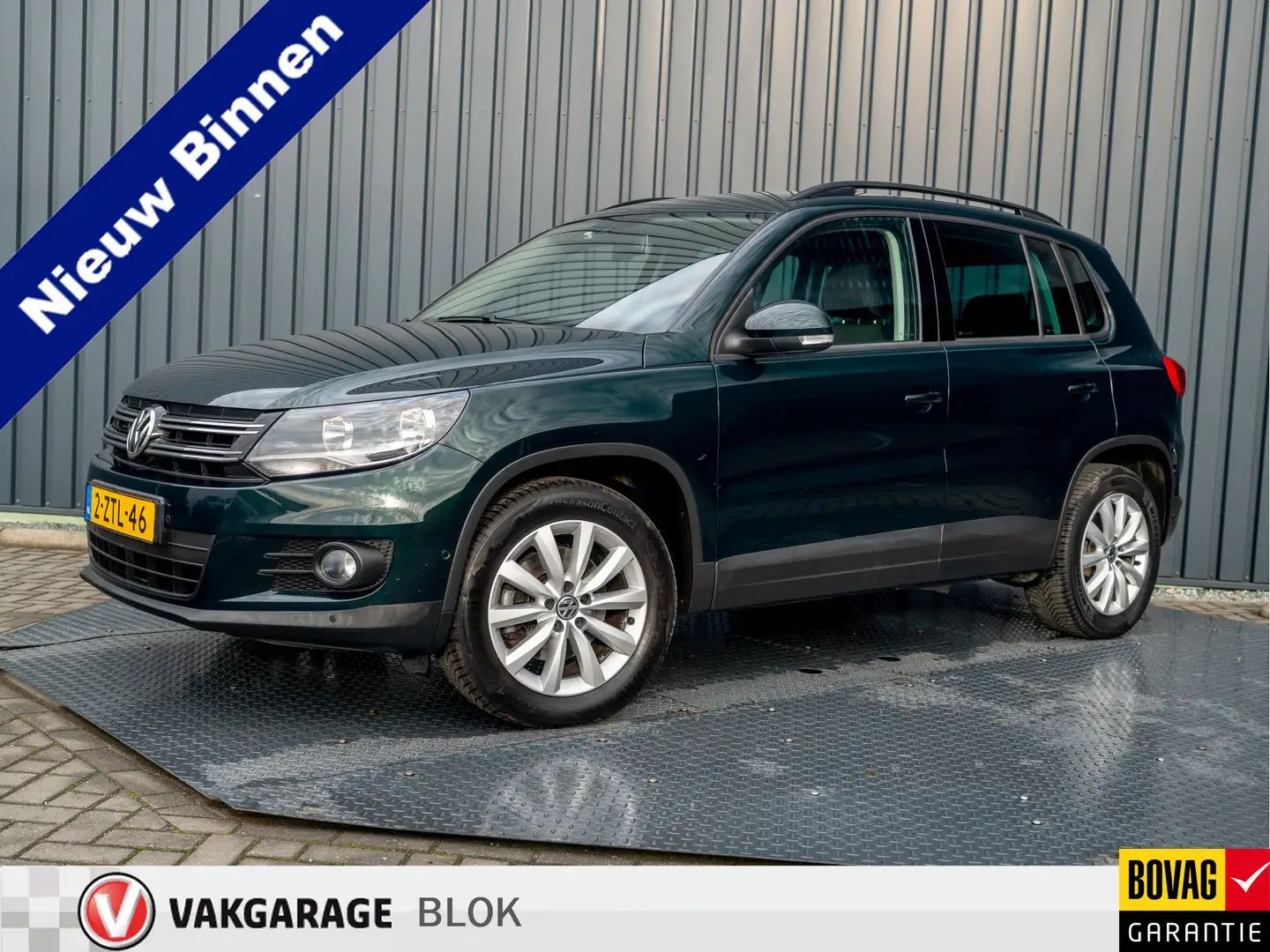 Volkswagen Tiguan 1.4 TSI Comfort&Design Edition | Navi | Parkeersen Groen - 1
