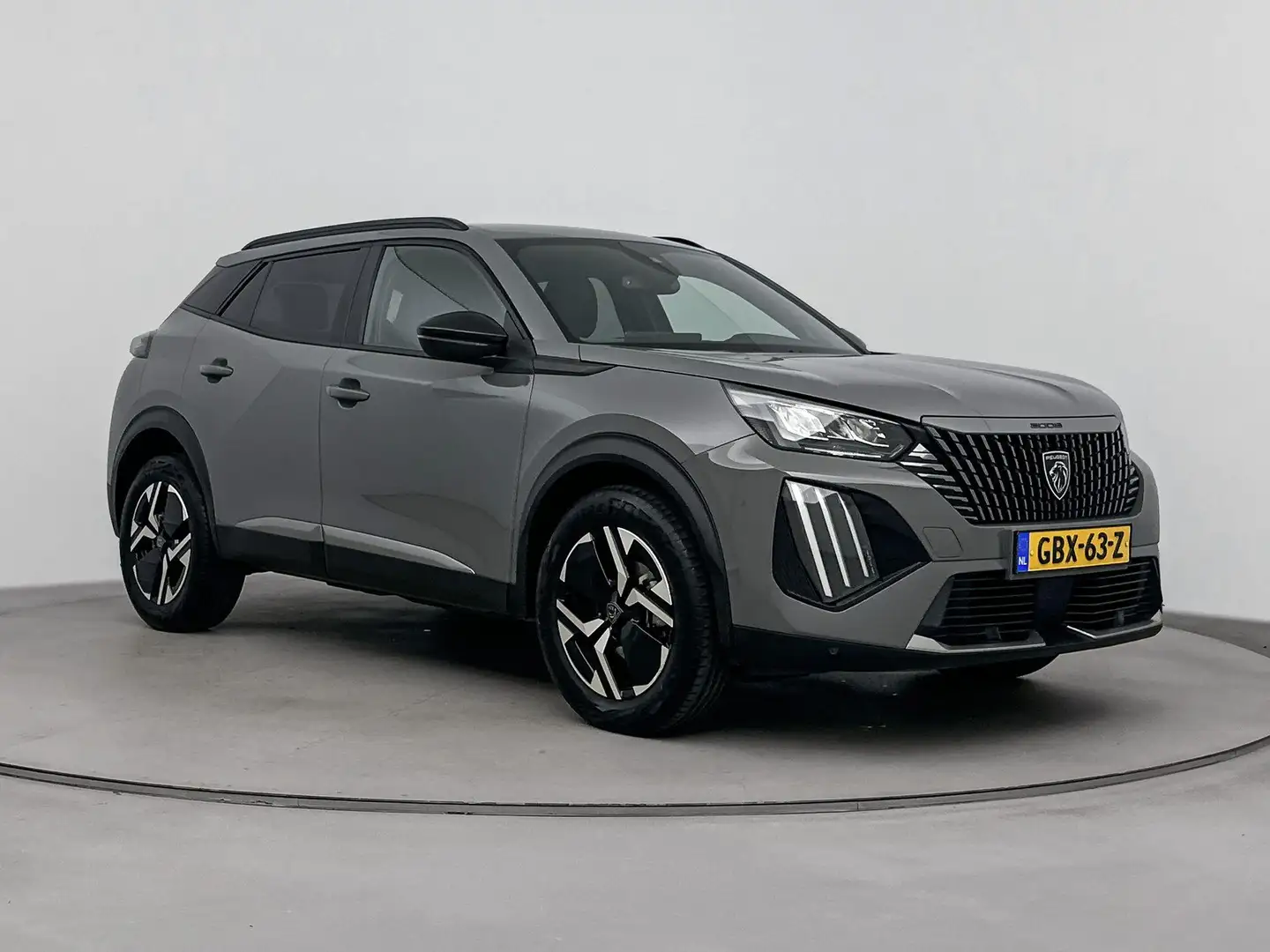 Peugeot 2008 SUV 1.2 100 pk Allure | Navigatie | Camera | Led | Grijs - 2