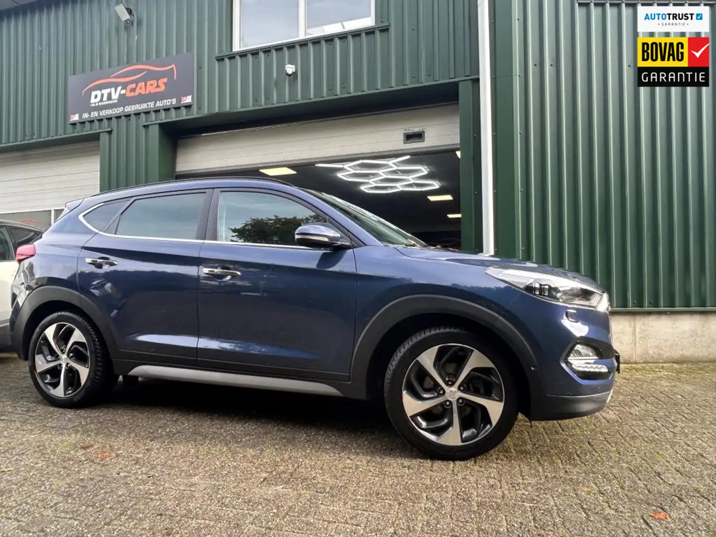 Hyundai TUCSON 1.6 T-GDi Comfort 4WD automaat Pano Full opties Blauw - 1