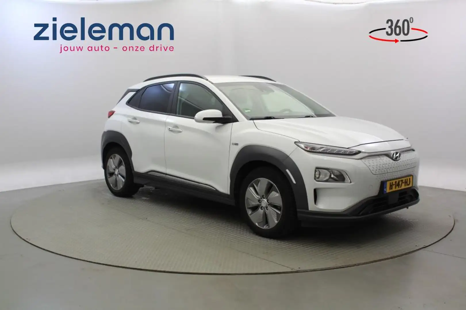Hyundai KONA Fashion 64 kWh - Carplay, Camera, Cruise, SOH 90% Wit - 1