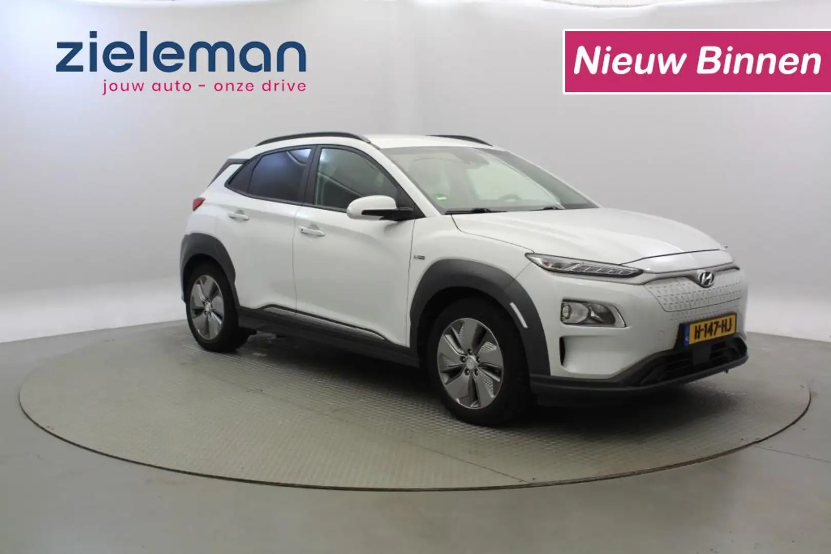 Hyundai KONA Fashion 64 kWh - Carplay, Camera, Cruise, SOH 90% Wit - 1