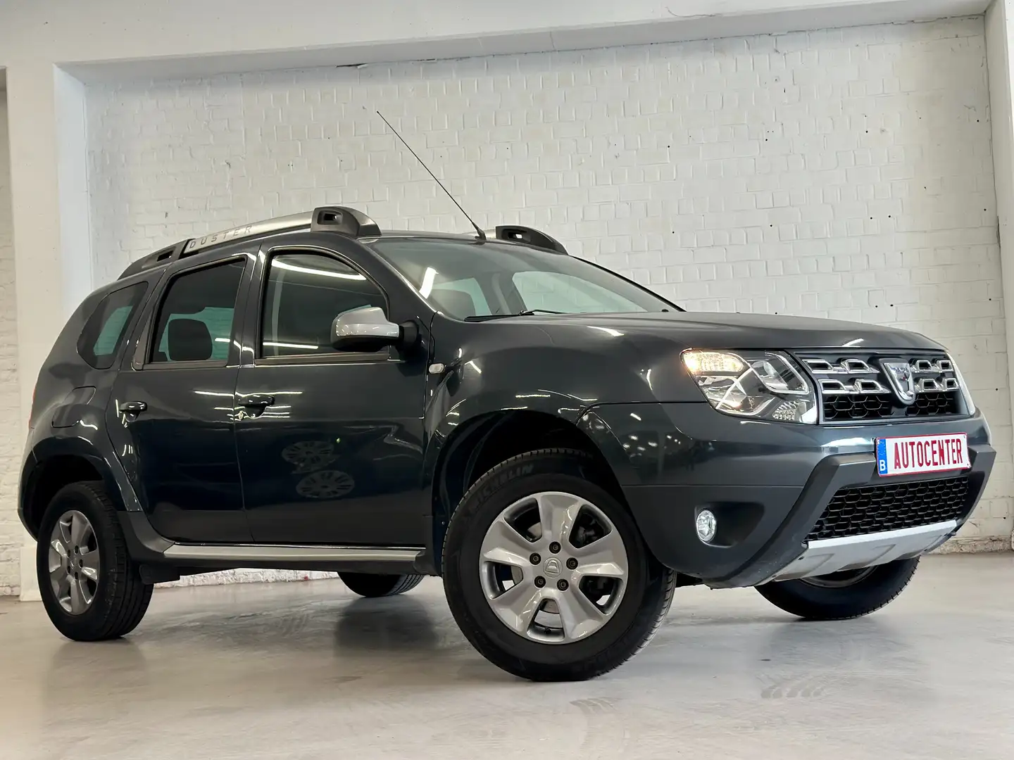 Dacia Duster 1.2 Benzine Euro 5b 2015 Gris - 1