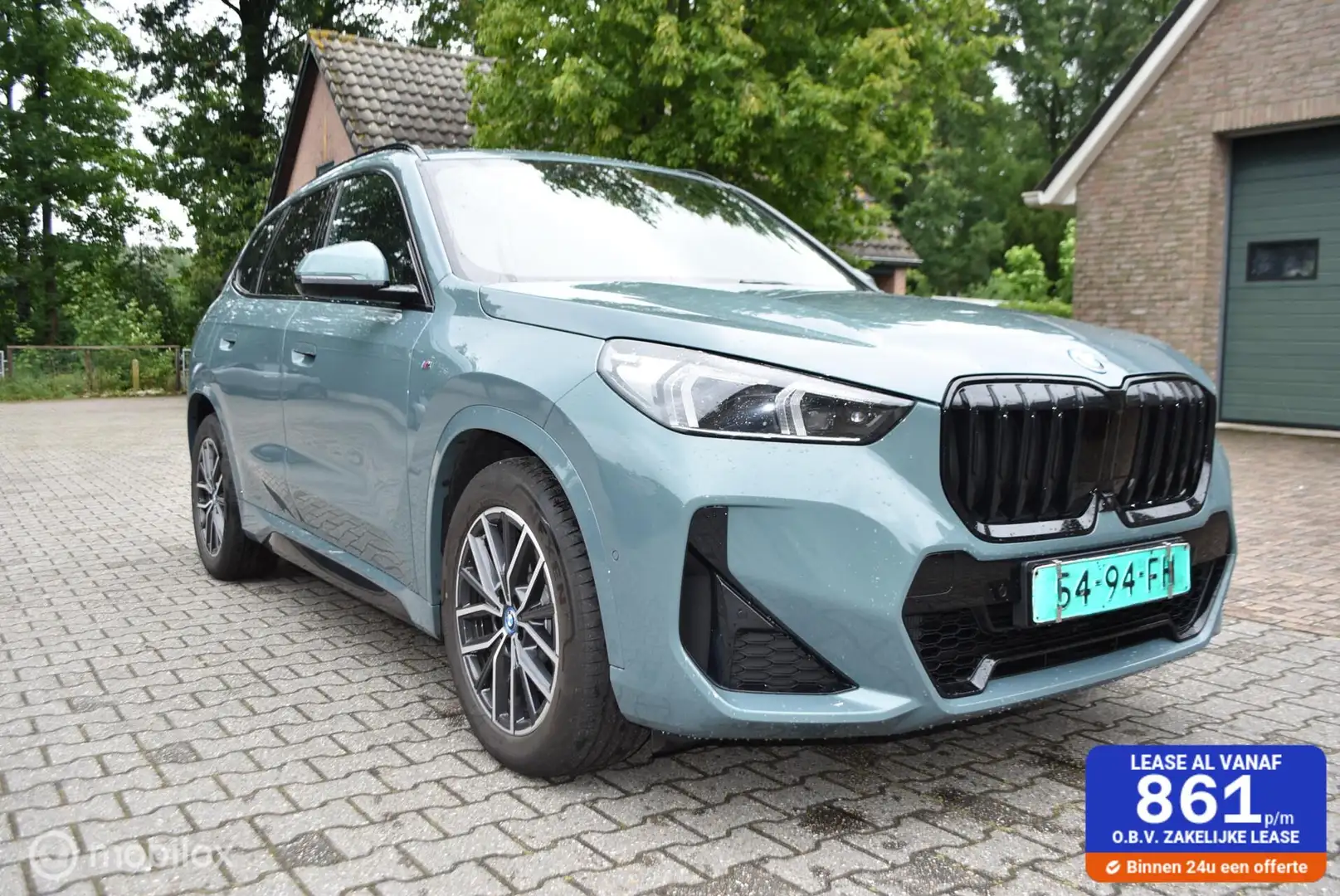 BMW X1 2.5 E X Drive aut Hybrid M Sportpakket X1 2.5E X D Groen - 1