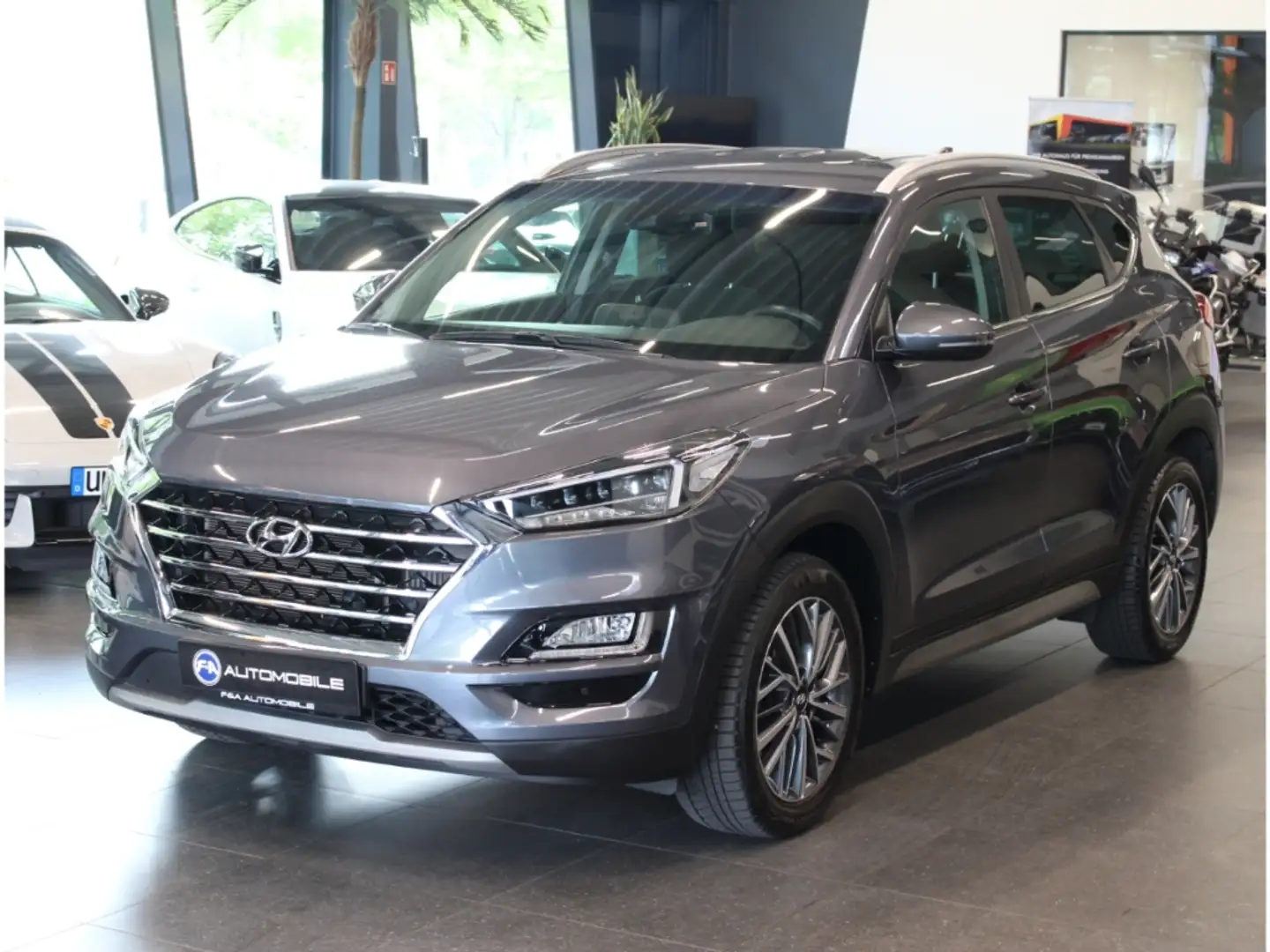 Hyundai TUCSON Style 4WD 1.6 *Navi*Kamera *LED* Grau - 1