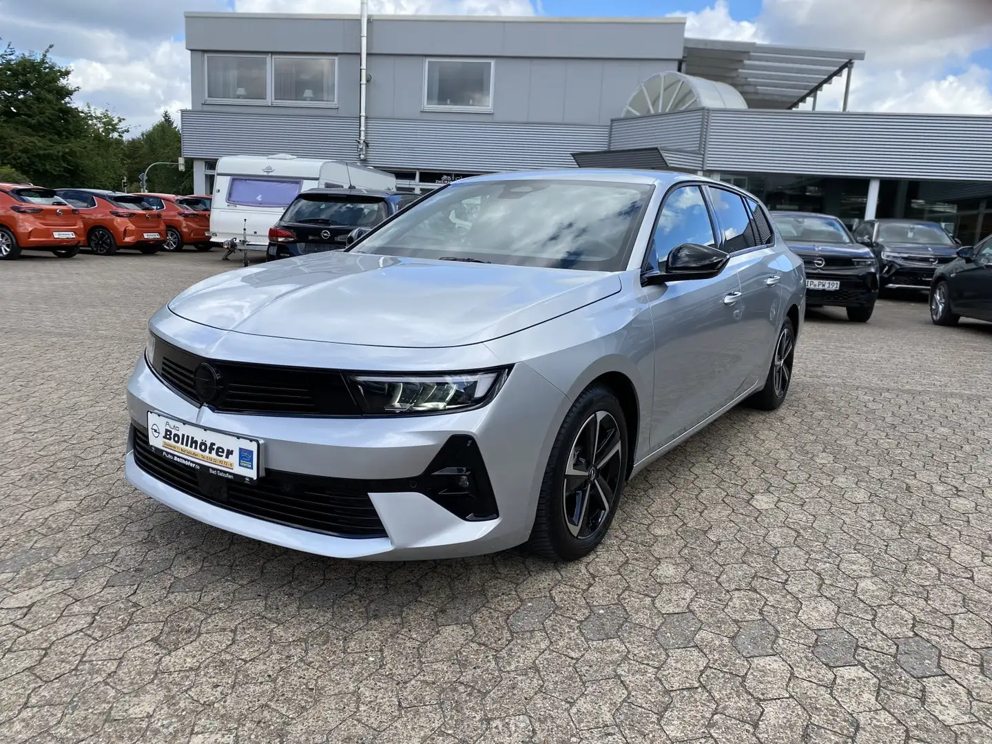 Opel Astra ST GS NAVI/SHZ+LHZ/PDC vo+hi+360Cam/Allwetter Silber - 1