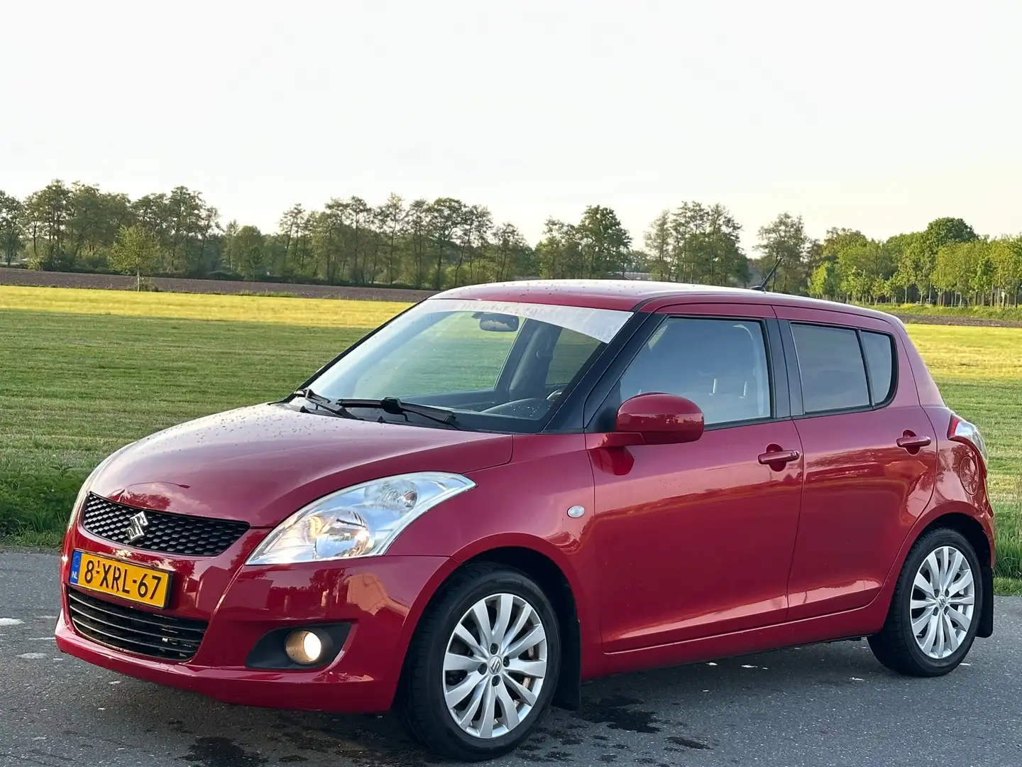 Suzuki Swift 1.2 Exclusive | Nap | Clima | Pdc Achter Червоний - 1