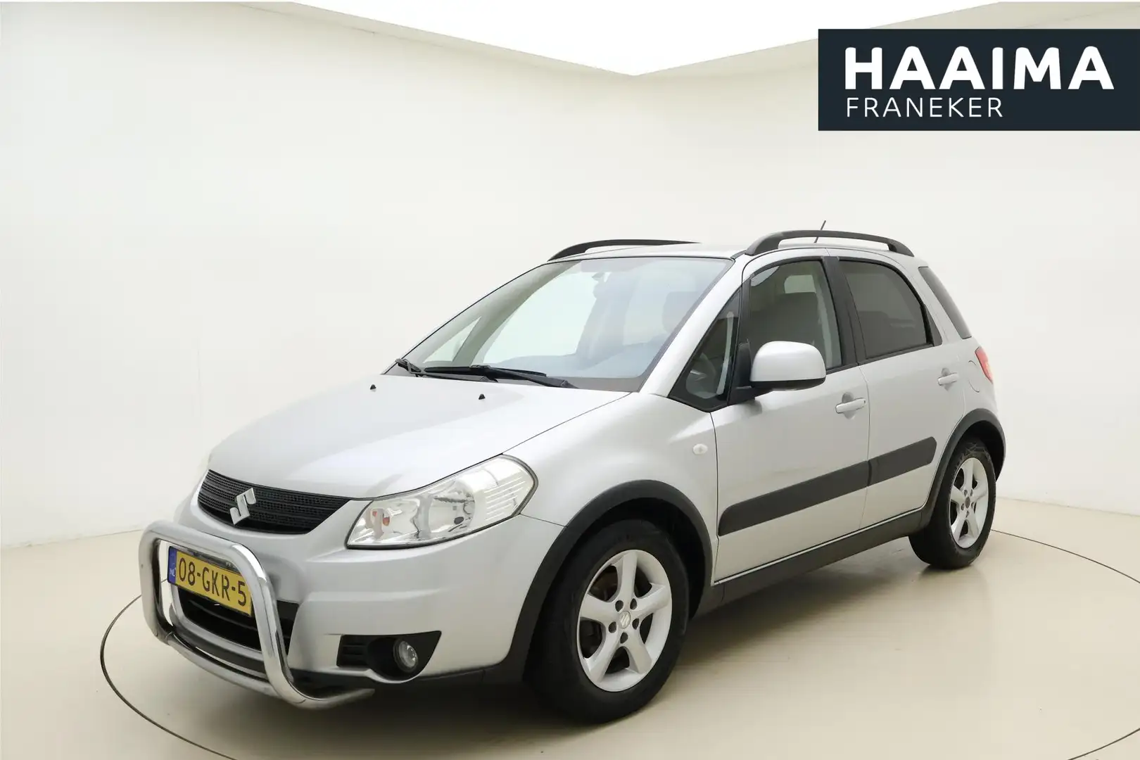 Suzuki SX4 1.6 Shogun 107pk | Airco | Cruise Control | Lichtm Grijs - 1
