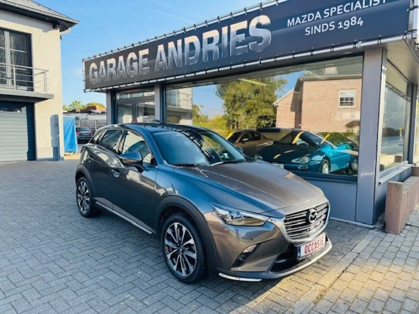 Mazda CX-3 2.0 BENZINE EURO 6D / CAMERA / NAVI / 2J WAARBORG Grijs - 2