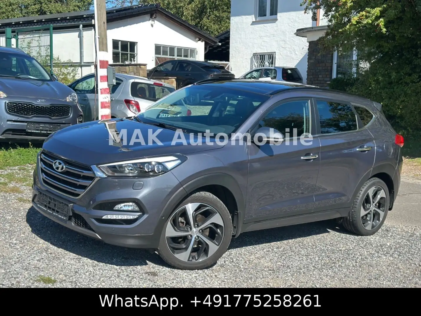Hyundai TUCSON Premium 4WD Pano,Navi,Leder,Kam Grau - 1