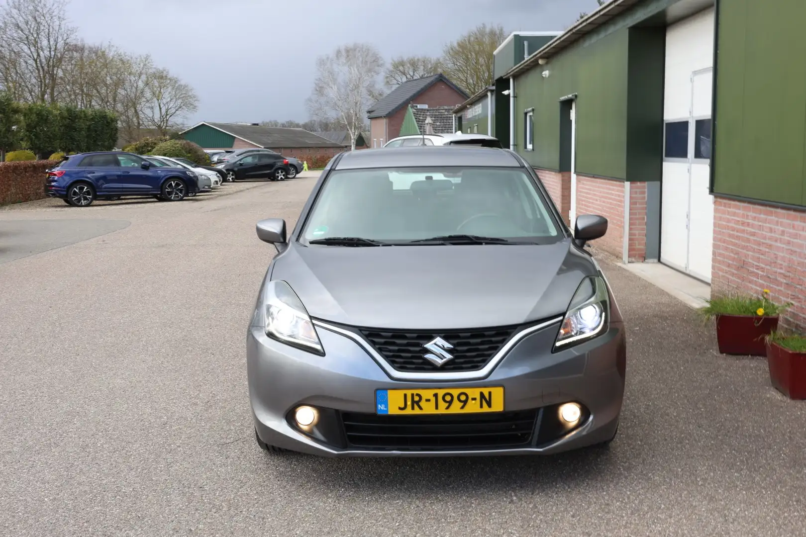 Suzuki Baleno 1.2 Exclusive, Automaat, Airco, NL 2e Eig. Dealer Gris - 2