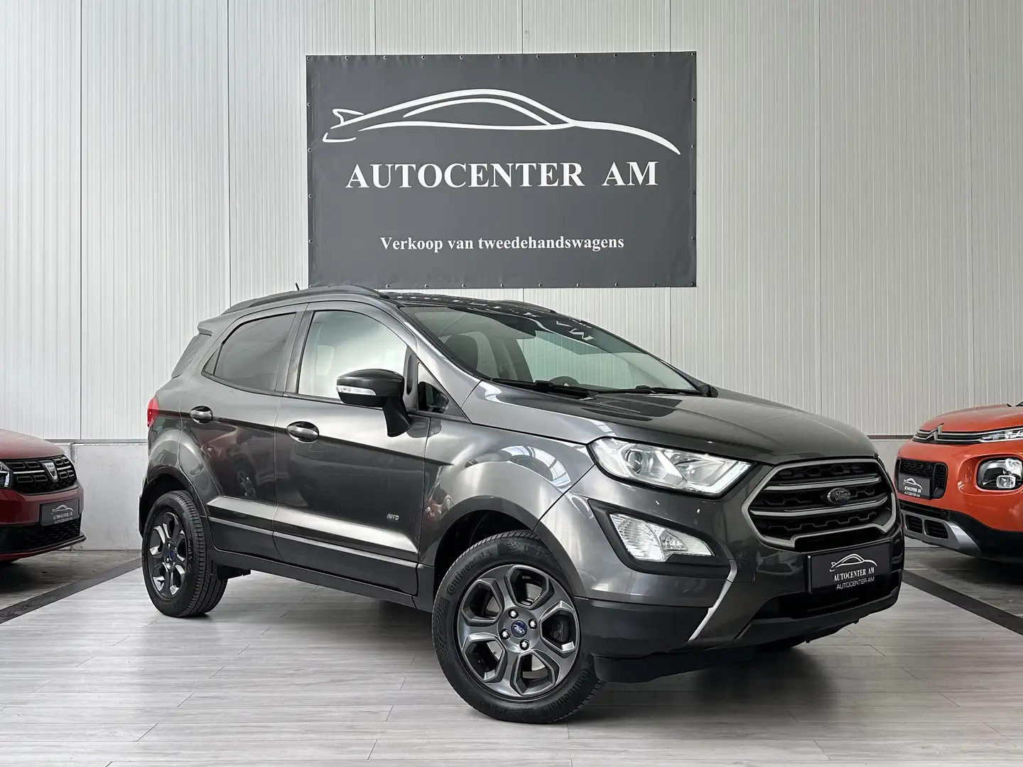 Ford EcoSport 1.5 EcoBlue TREND 4X4!! Cruise / Navi / Carplay Grijs - 1