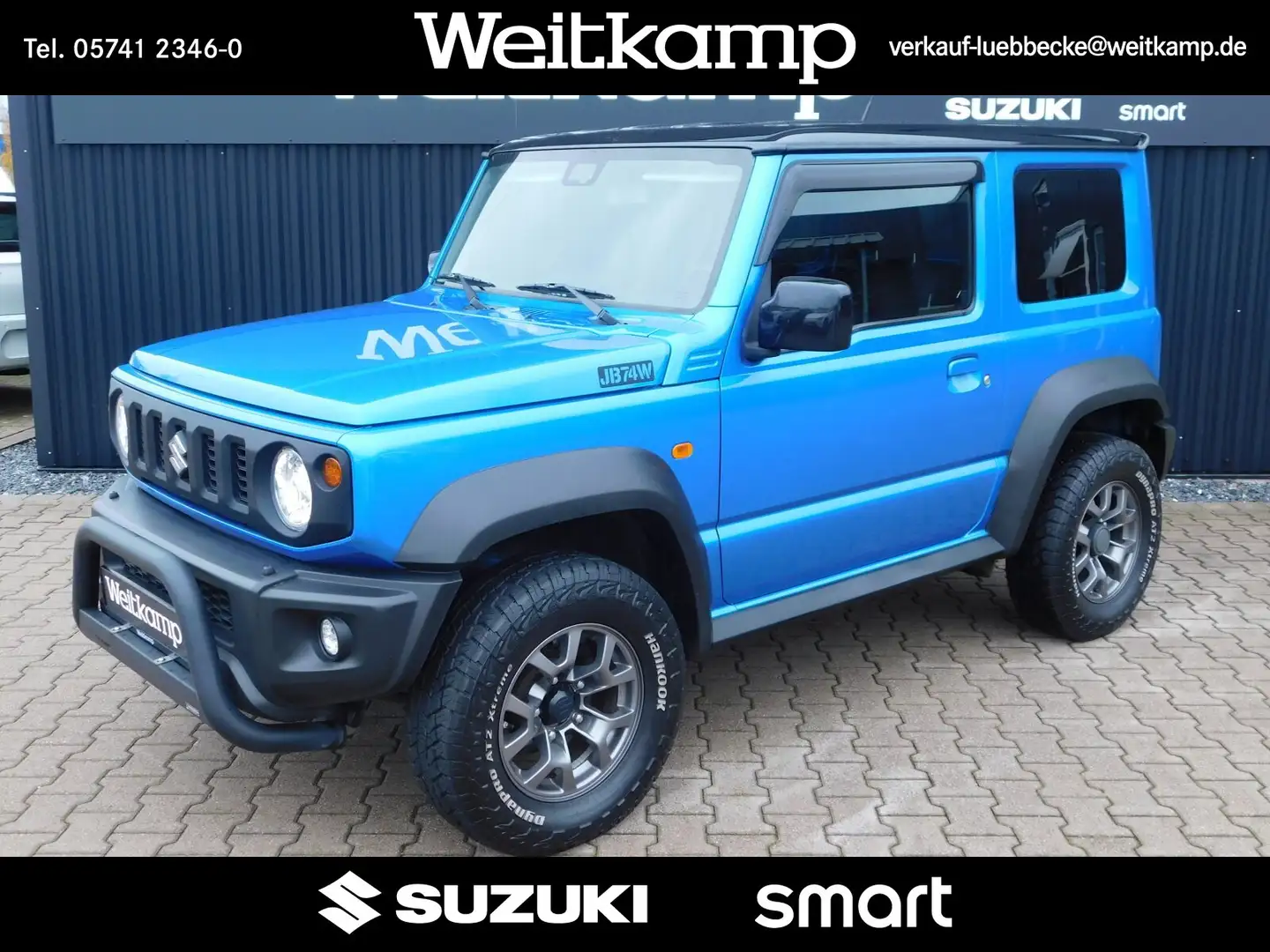 Suzuki Jimny Jimny 1.5 Allgrip Comfort+ 4 Sitzer Navi 1.Hand Blau - 1