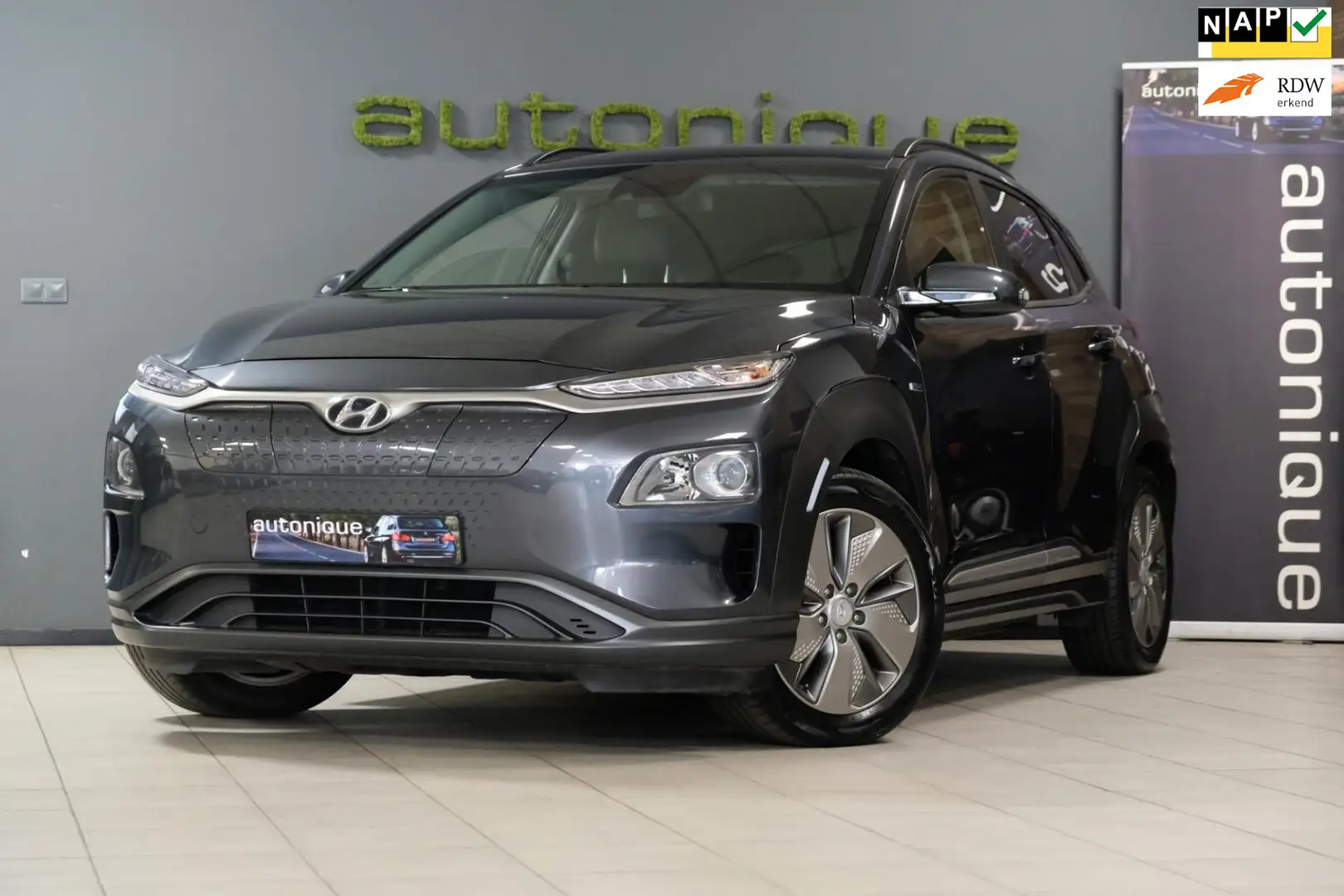 Hyundai KONA EV Comfort 39 kWh *Achteruitrijcamera* |39.486km| Grau - 1