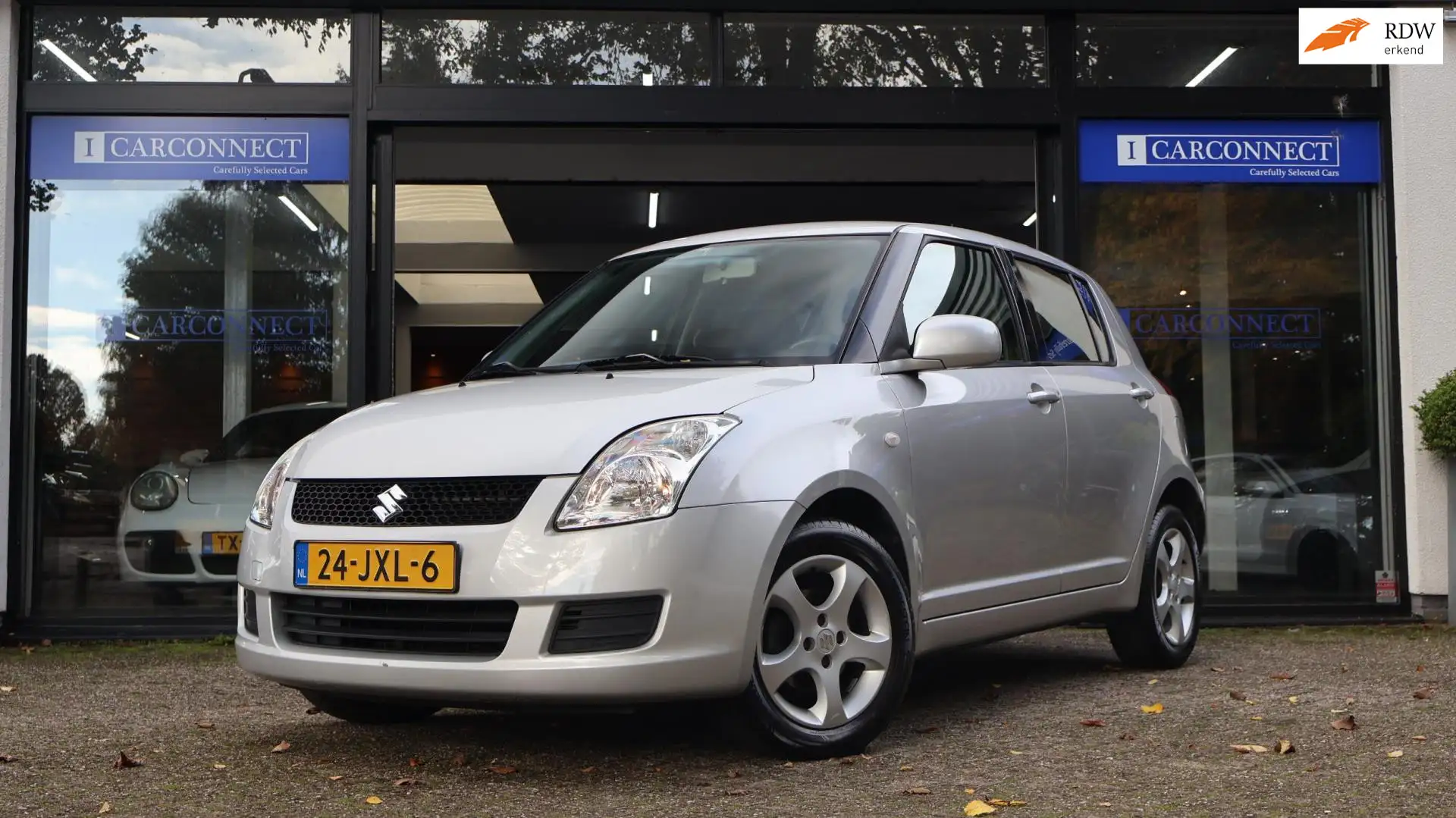 Suzuki Swift 1.3 4Grip Exclusive 92pk|Airco|LMV|Stoelverwarming Gris - 1