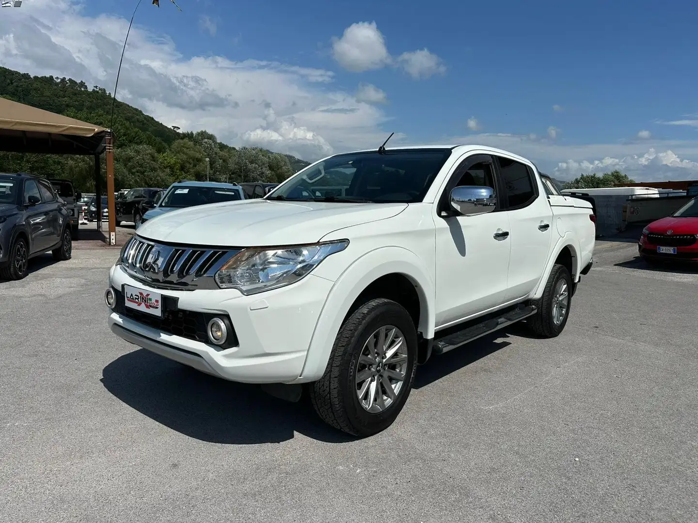 Mitsubishi L200 L200 d.cab 2.4d Intense 4wd 154cv N1 SUPER SELEK Bianco - 1