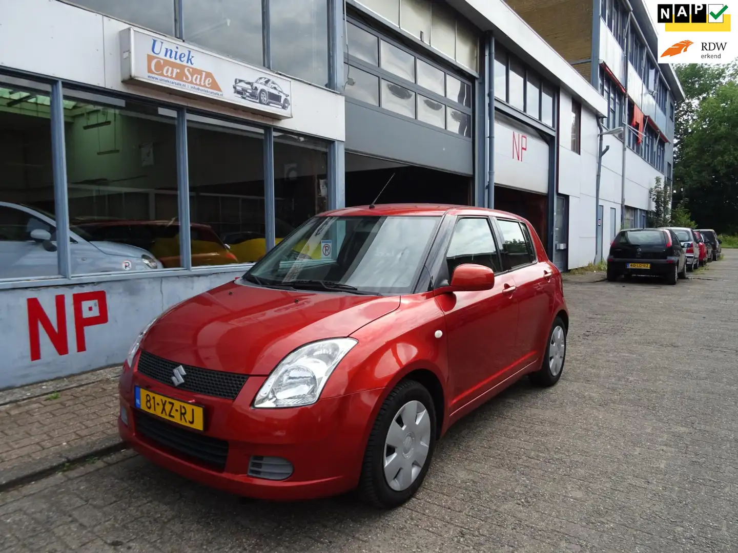 Suzuki Swift 1.3 Cool Oranje - 1