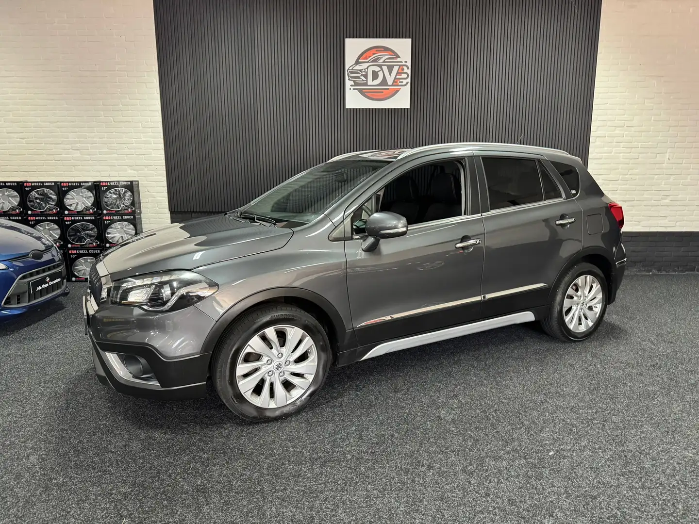 Suzuki S-Cross 1.4 Boosterjet High Executive, NAV, STL VERW, CRUI Grijs - 1