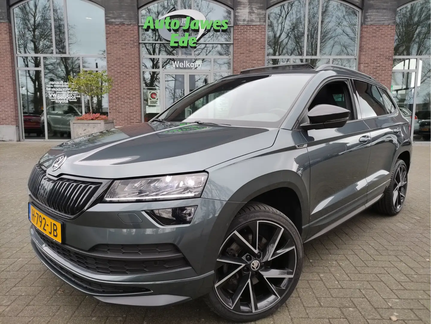Skoda Karoq 1.5 TSI DSG ACT Sportline Business Panoramadak - 1 Gris - 1