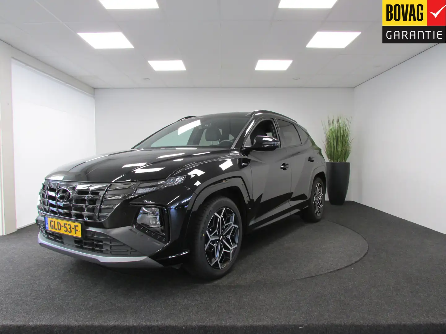 Hyundai TUCSON 1.6 T-GDI PHEV N Line Sky 4WD I OP AFSPRAAK I Pano Zwart - 1