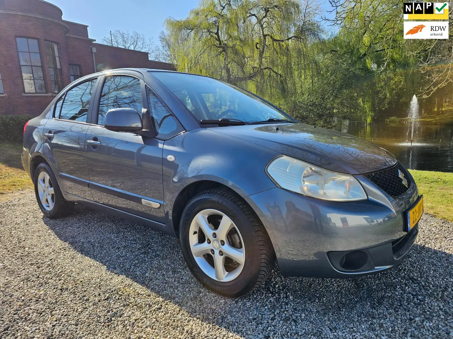 Suzuki SX4 1.6 Comfort sedan AIRCO *82.000km* Grijs - 1