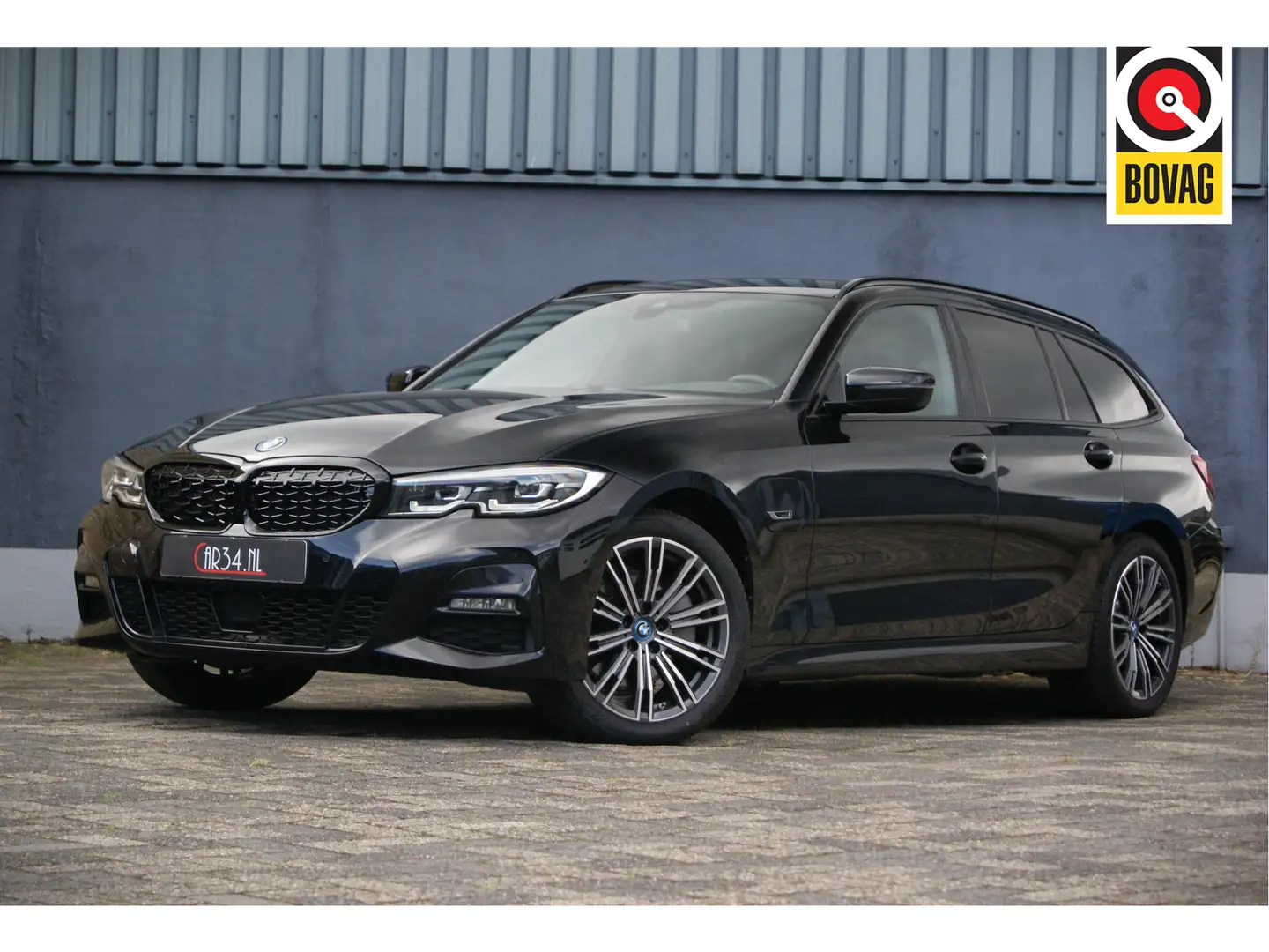 BMW 320 3-serie Touring 320e 204PK xDrive High Ex. M-Sport Zwart - 1