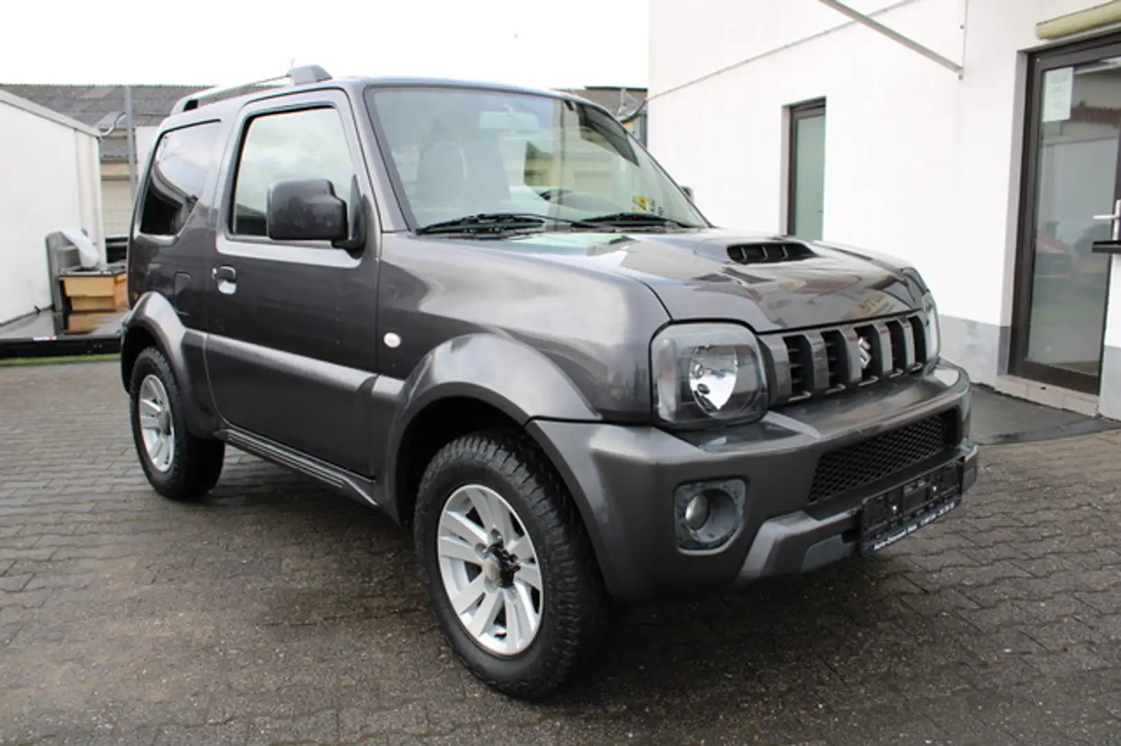 Suzuki Jimny Style Lim. *Klima*Leder*Sehr gepflegt* Schwarz - 1