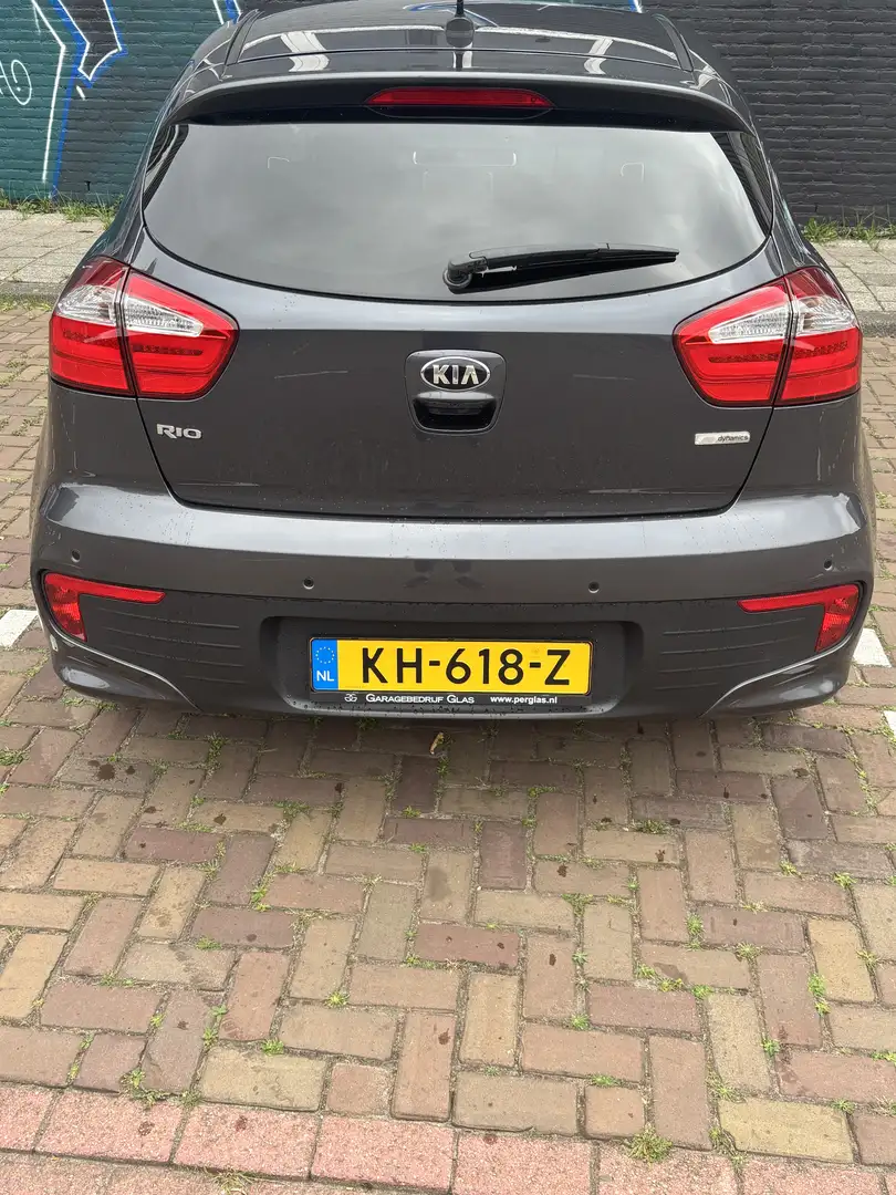 Kia Rio 1.2 CVVT ExecutiveL. Grijs - 1