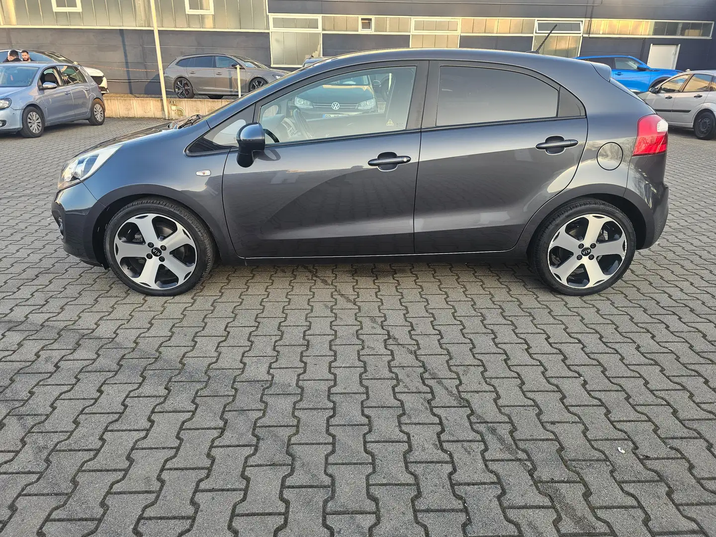 Kia Rio 1.2 Edition7,Klima,PDC,Alu,Navi,Lenkradheizung,Vol Gris - 1