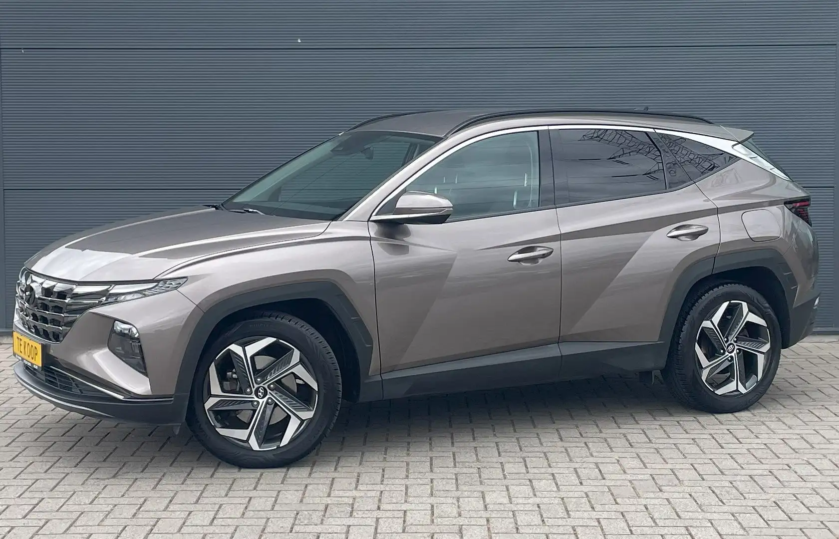 Hyundai TUCSON 1.6 T-GDi HEV Feel Comfort Pack Brons - 1
