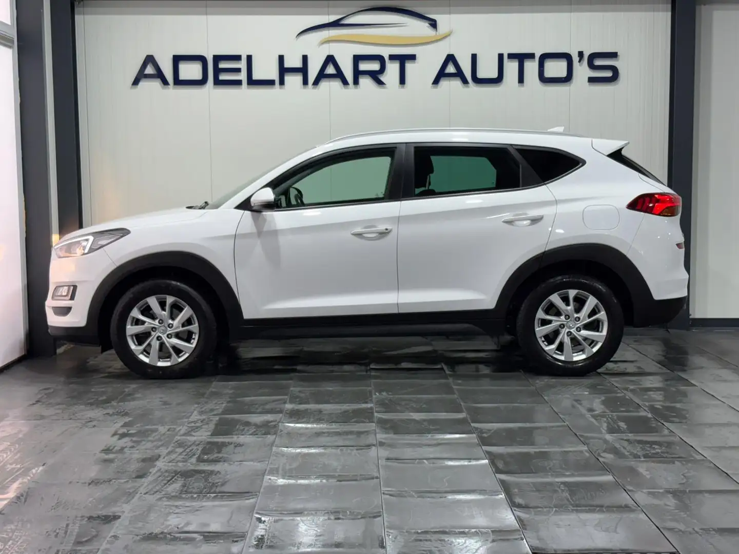 Hyundai TUCSON 1.6 T-GDI Comfort Automaat 177 PK / Navigatie full Wit - 2