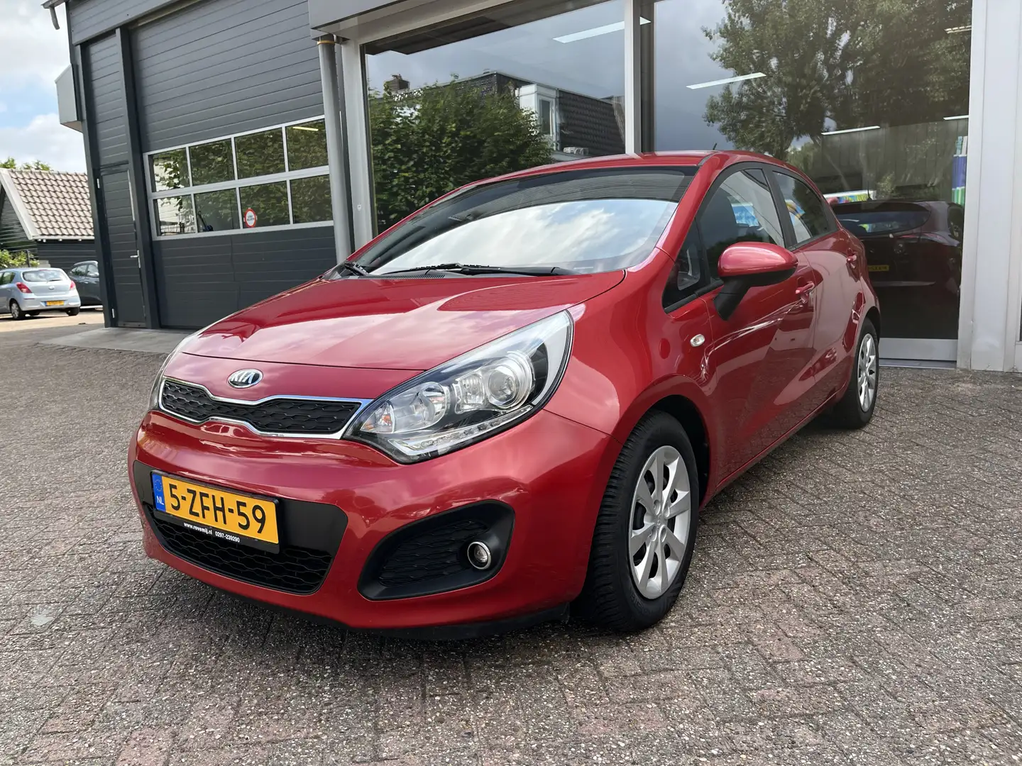 Kia Rio 1.2 CVVT BusinessLine Cruise Controle, Bluetooth, Rood - 1