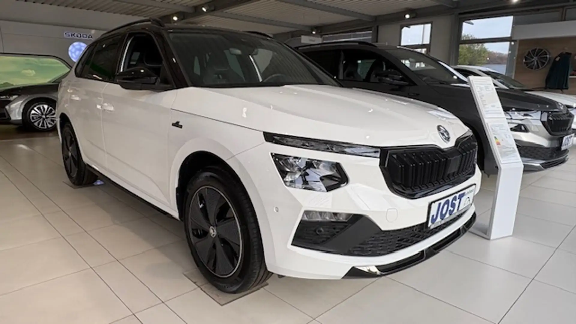 Skoda Kamiq Monte Carlo 1.5 TSI DSG AHK/Navi/MatrixLED/Kessy/Pano/Kamera/ACC Weiß - 1