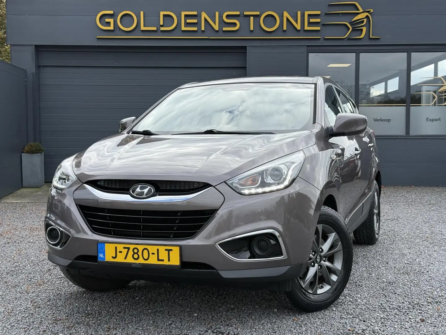 Hyundai iX35 1.6i GDI i-Drive 1e Eigenaar,Airco,135pk,PDC,Elekt Bruin - 1