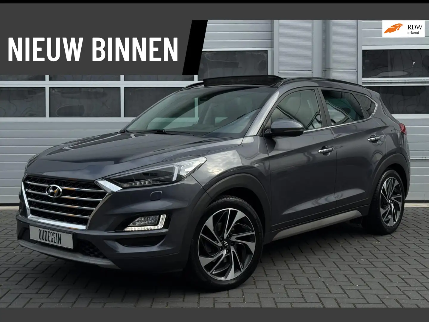 Hyundai TUCSON 1.6 T-GDI 4WD Premium / Pano / 360 Camera / Adapti Grijs - 1