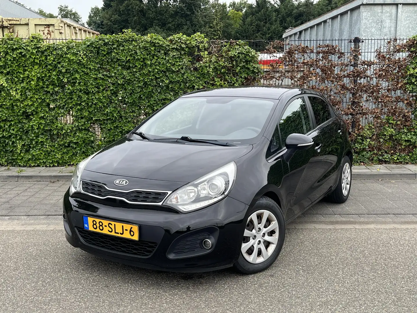 Kia Rio 1.2 CVVT Plus Pack * Airco * Apk 06-2026 * 5 deurs Black - 1
