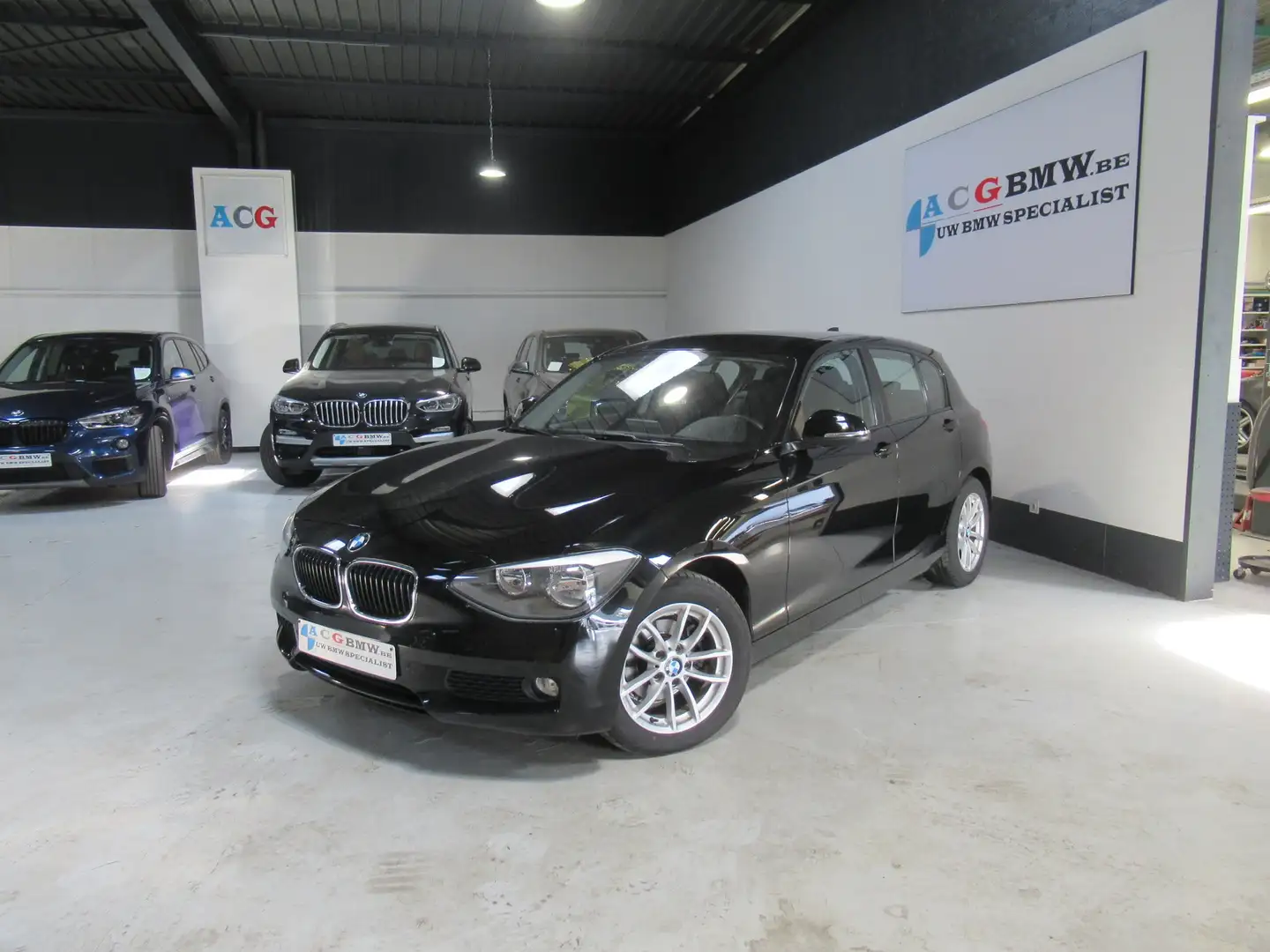 BMW 116 i Nieuwe ketting Benz PDC Lichtpack Stoelverwarmin Zwart - 1