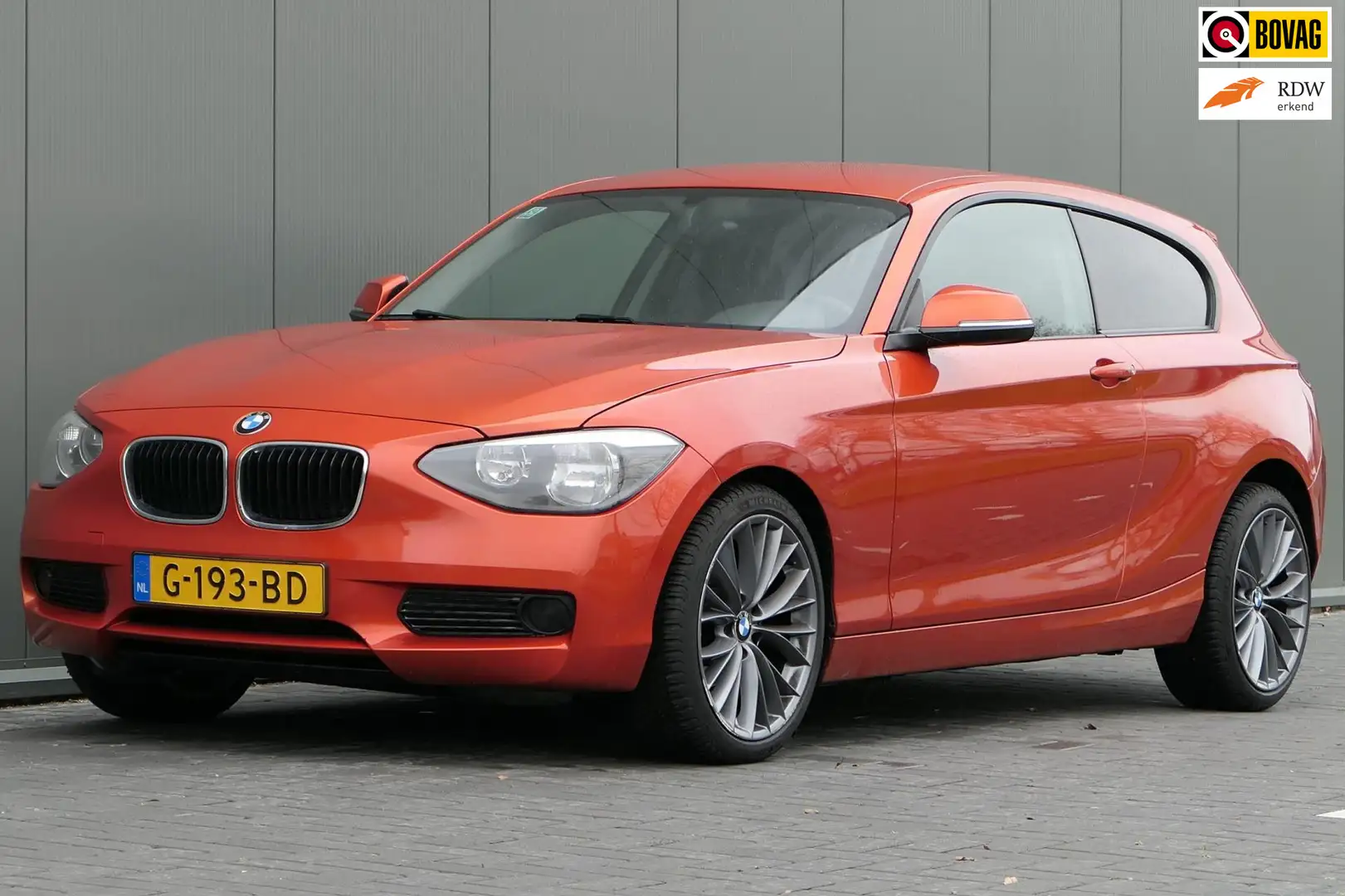 BMW 114 1-serie 114i EDE Business Airco Keyless Orange - 1