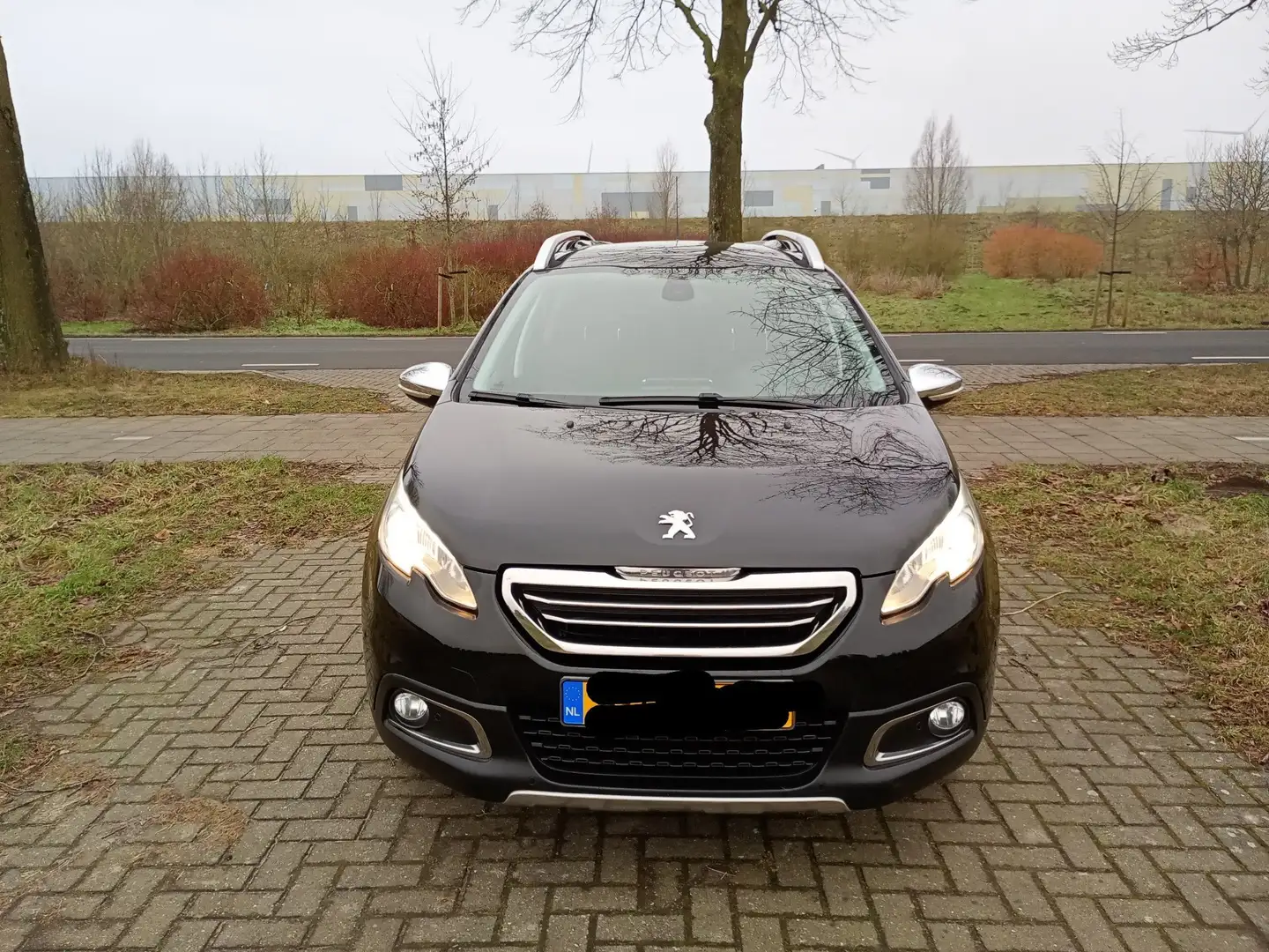Peugeot 2008 1.2 VTi All. Pack Pr Zwart - 1
