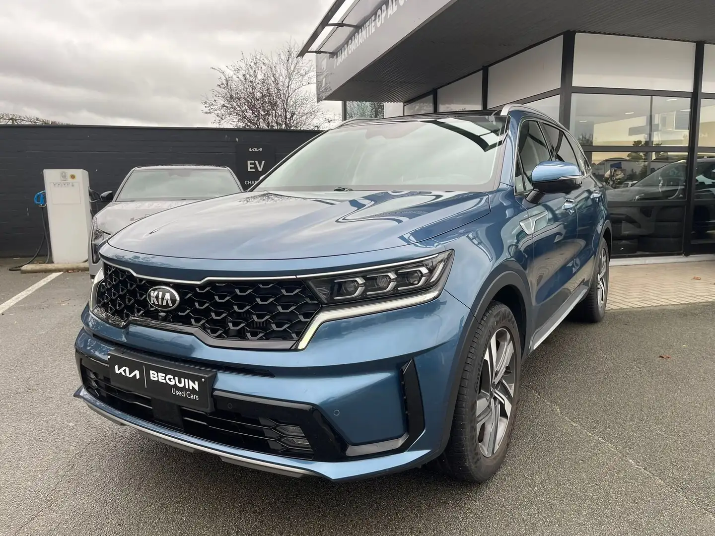 Kia Sorento 1.6 HEV AWD SENSE - LEDER - PANODAK - 7 ZIT - 360 Blauw - 1