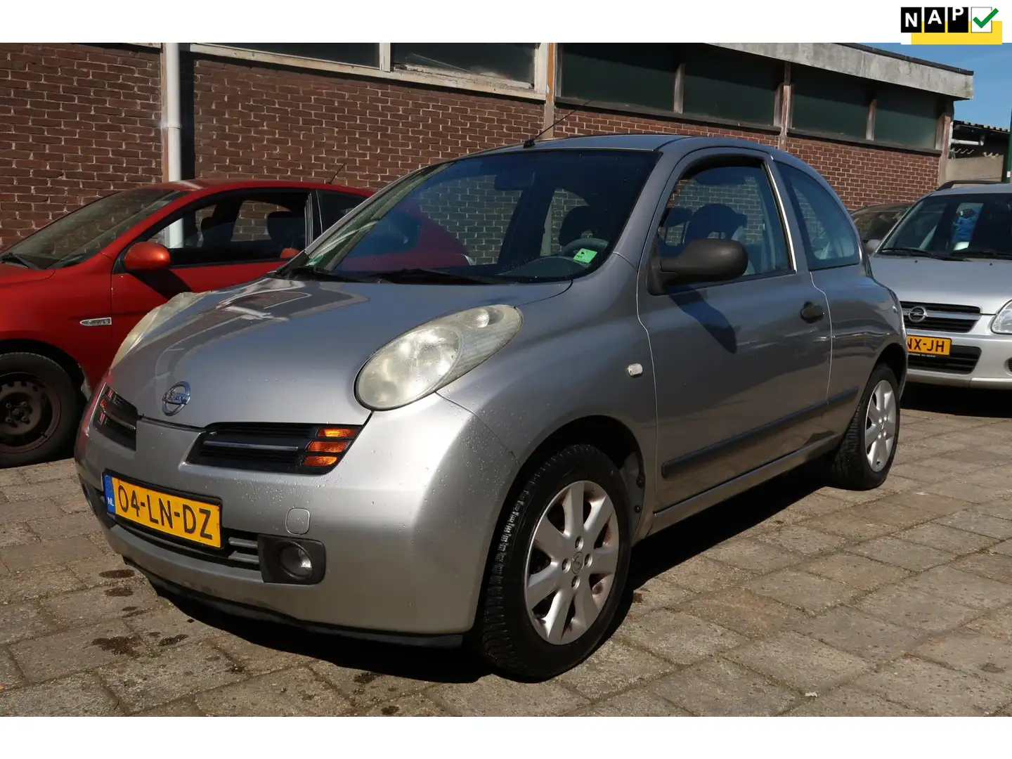 Nissan Micra 1.2 Visia Automaat, Stuurbekrachtiging Gris - 1