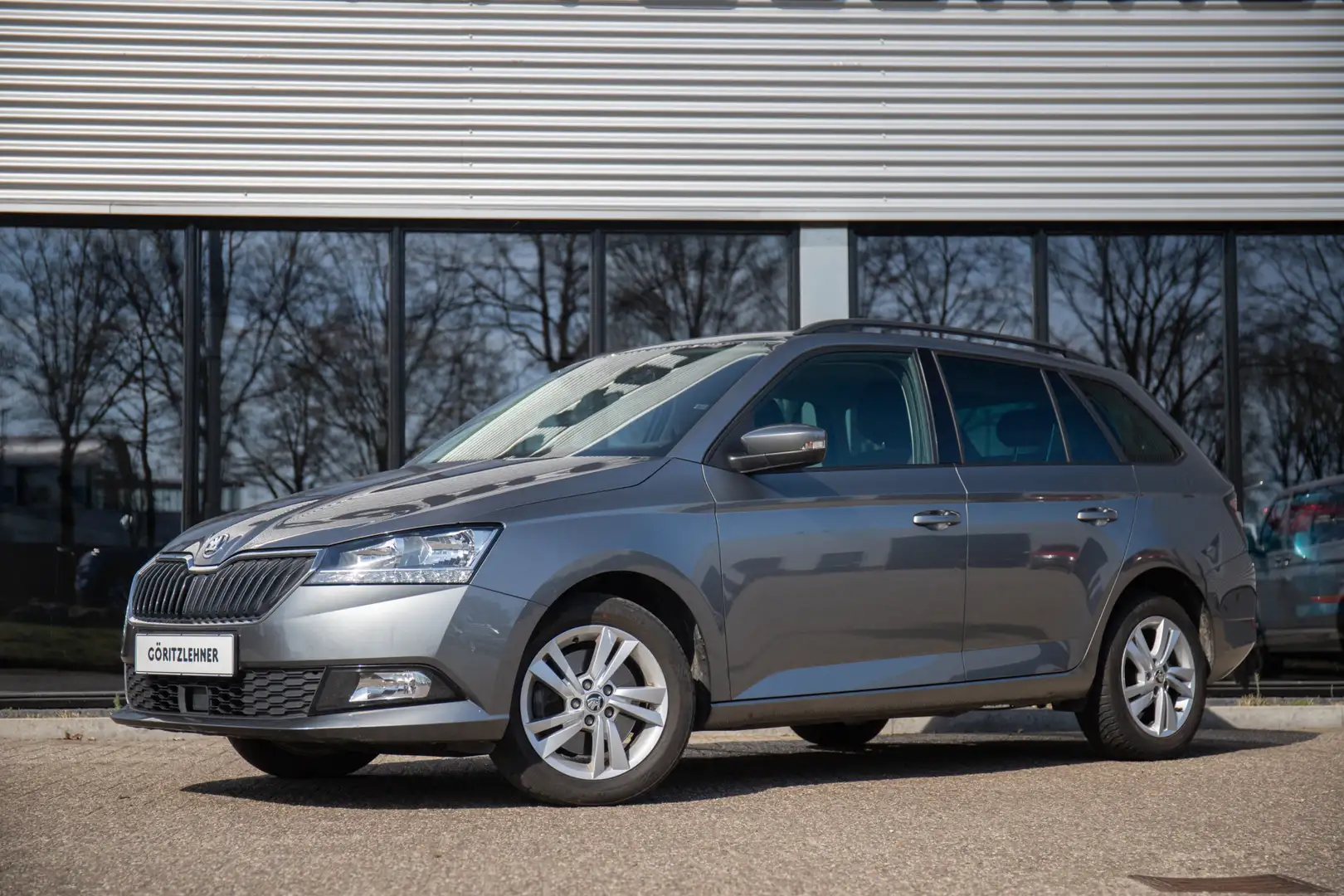 Skoda Fabia Combi 1.0 TSI Ambition | Navi by App | PDC | 15" | Grijs - 1
