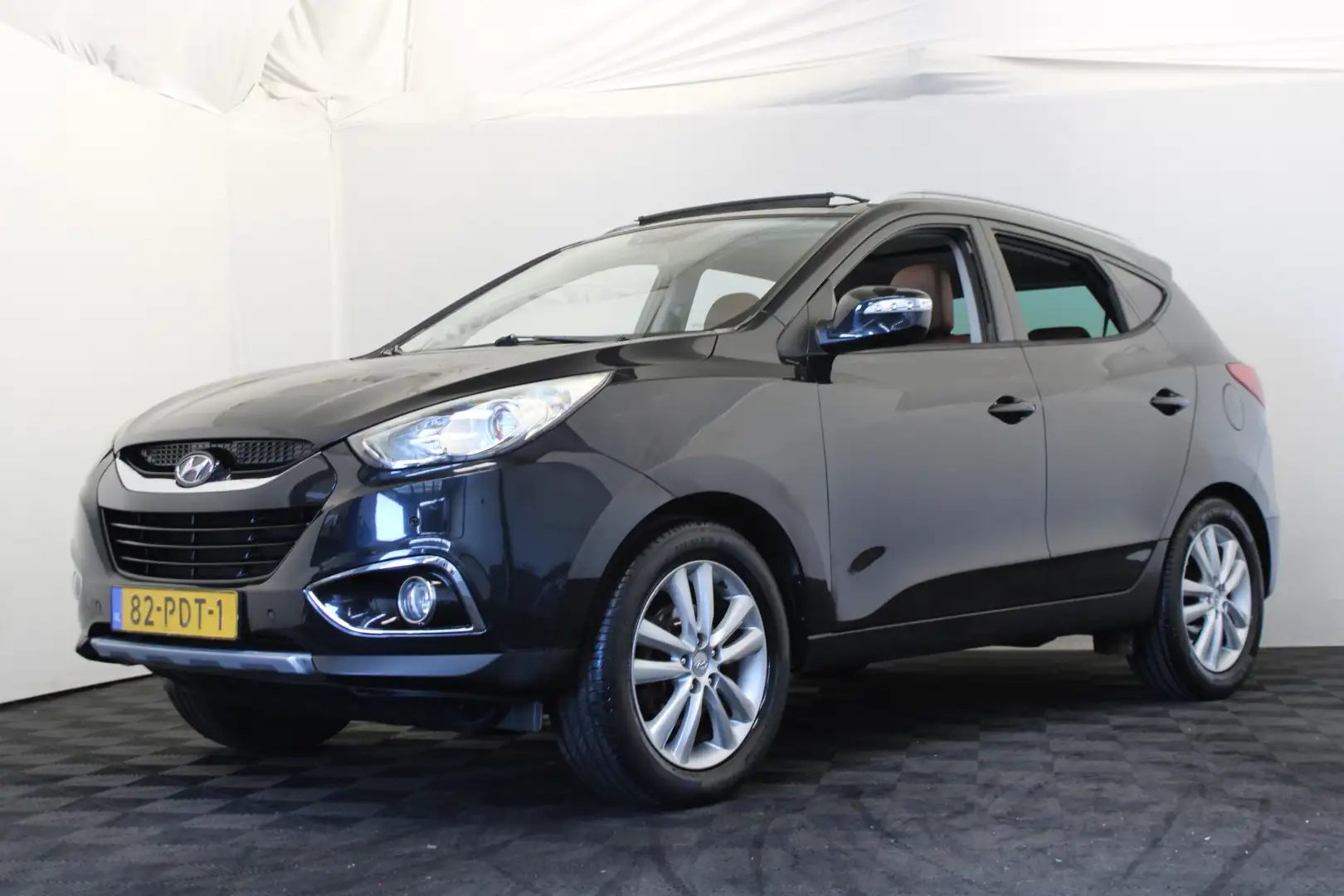 Hyundai iX35 2.0i i-Catcher |Pano|Leder|Trekhaak| Zwart - 1