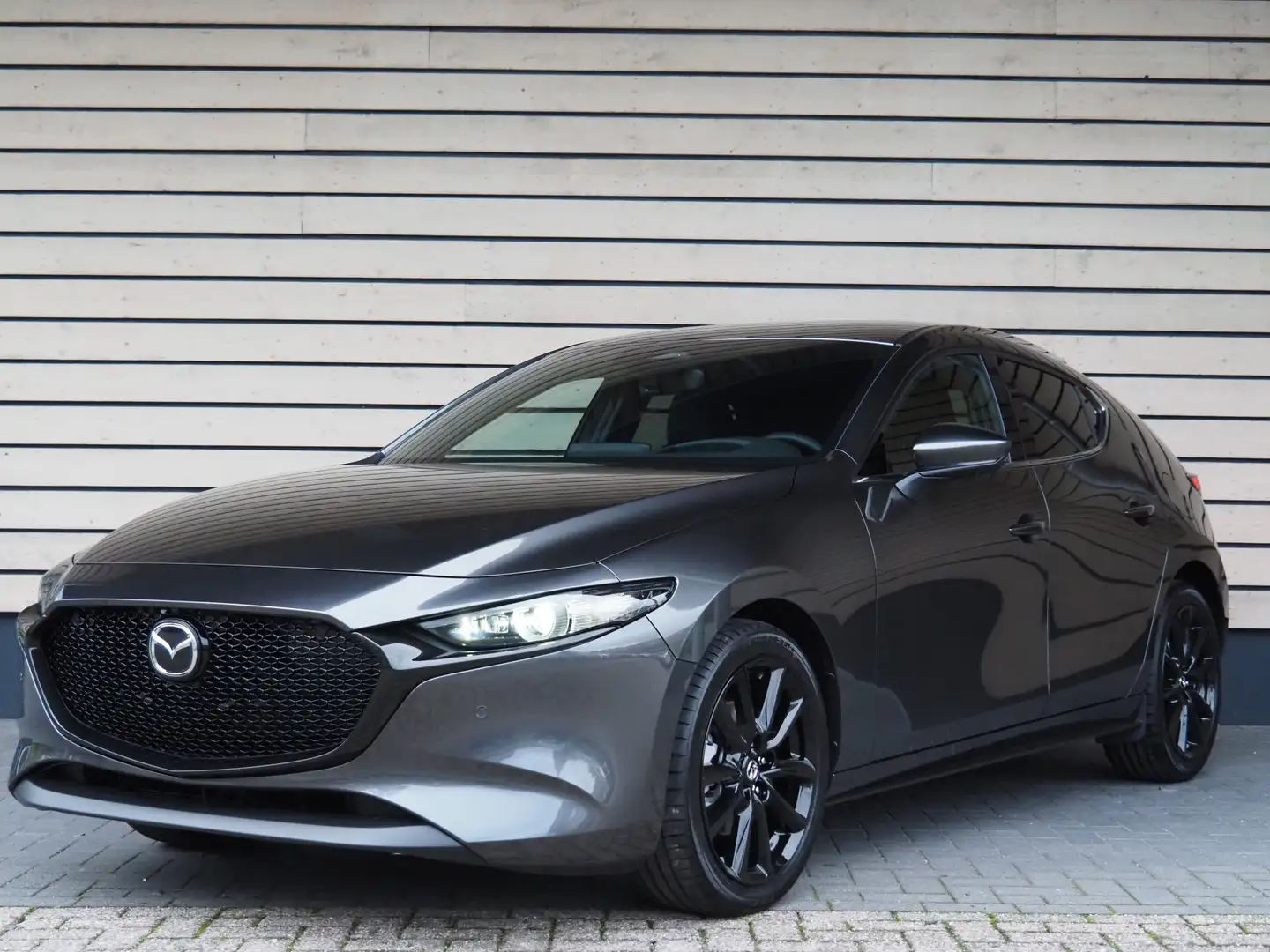 Mazda 3 2.0 e-SkyActiv-X M Hybrid 186 Takumi - Nu met € 3. Gris - 2