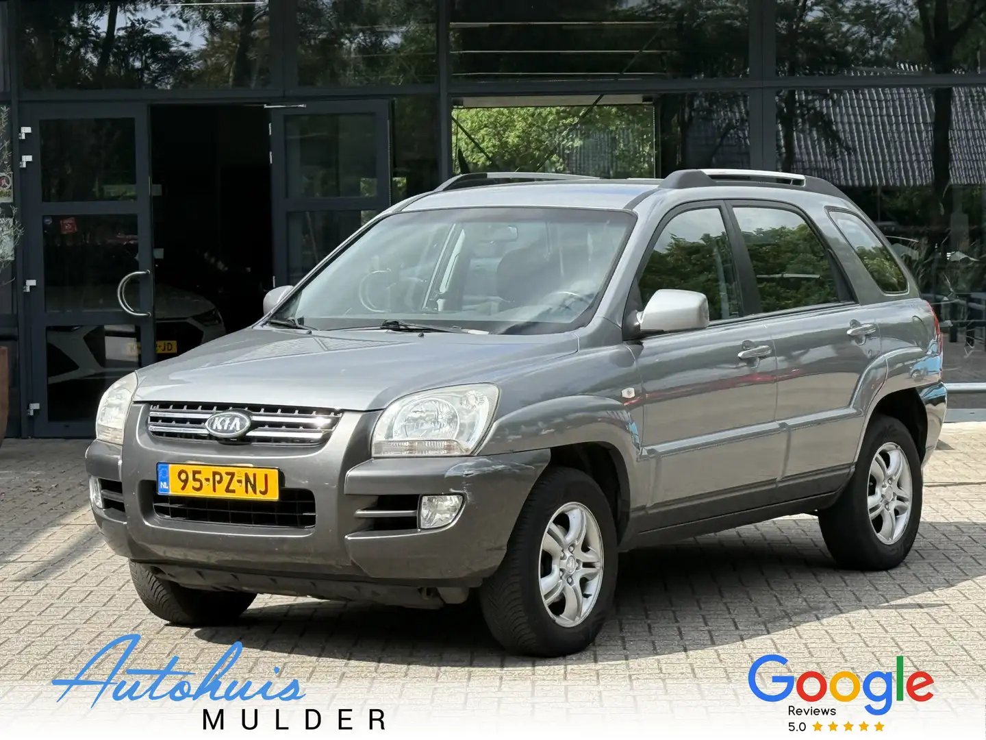 Kia Sportage 2.0 CVVT Comfort Airco/Cruise/Trekhaak/ SCHERPE ZO Grau - 1