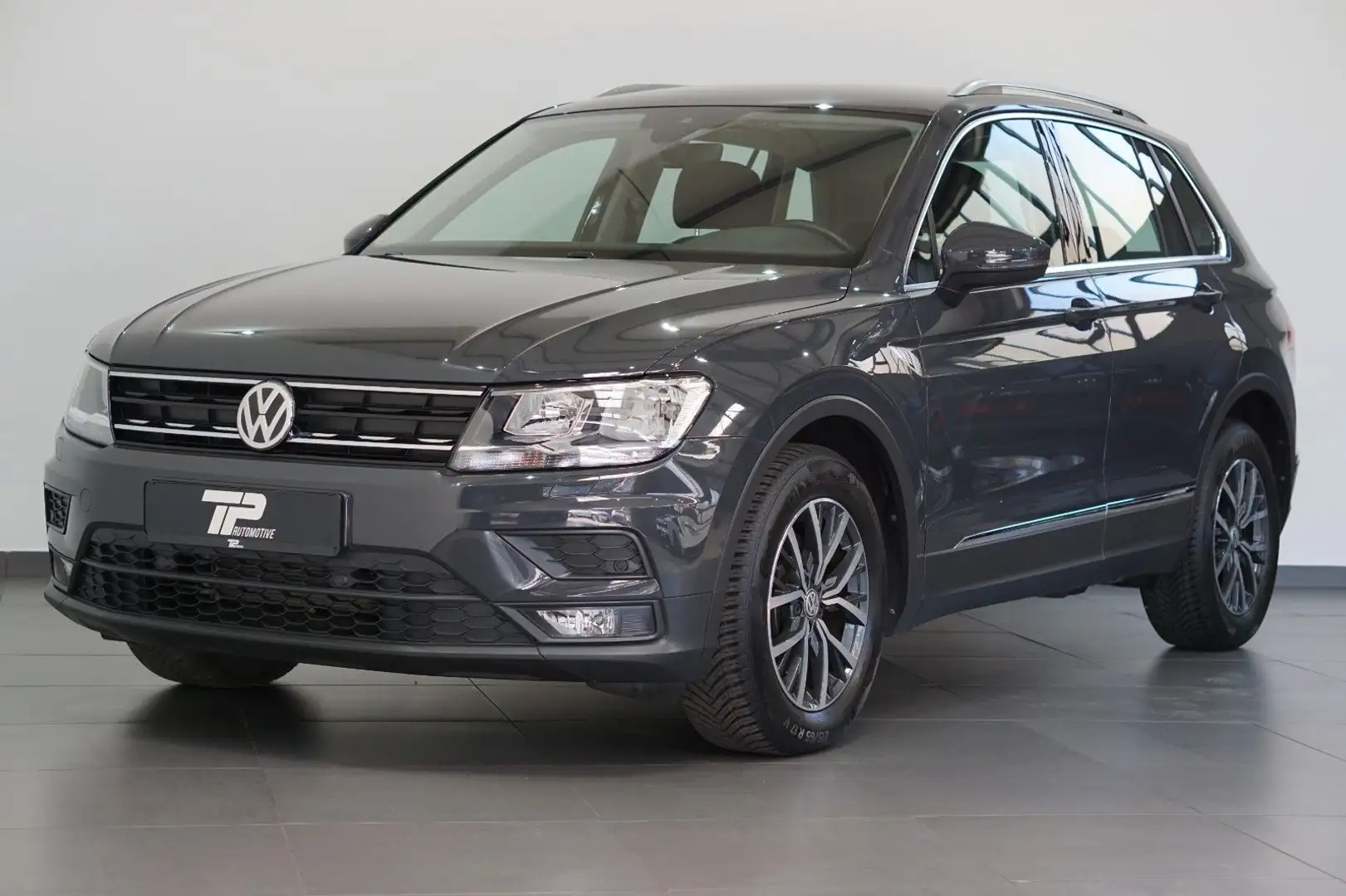 Volkswagen Tiguan 1.4 TSI Comfortline aus 1.Hand *Navi *PDC Grijs - 1