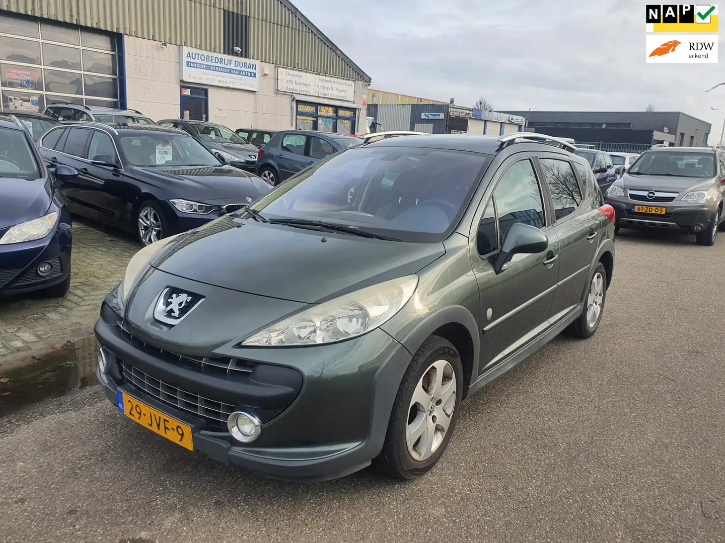 Peugeot 207 SW Outdoor 1.6 VTi Sublime Clima Bj.:2009 NAP! Grijs - 1